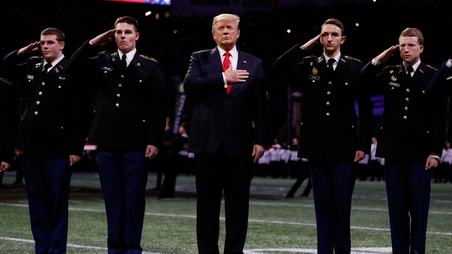 President Trump with his hand over his heart during the national anthem