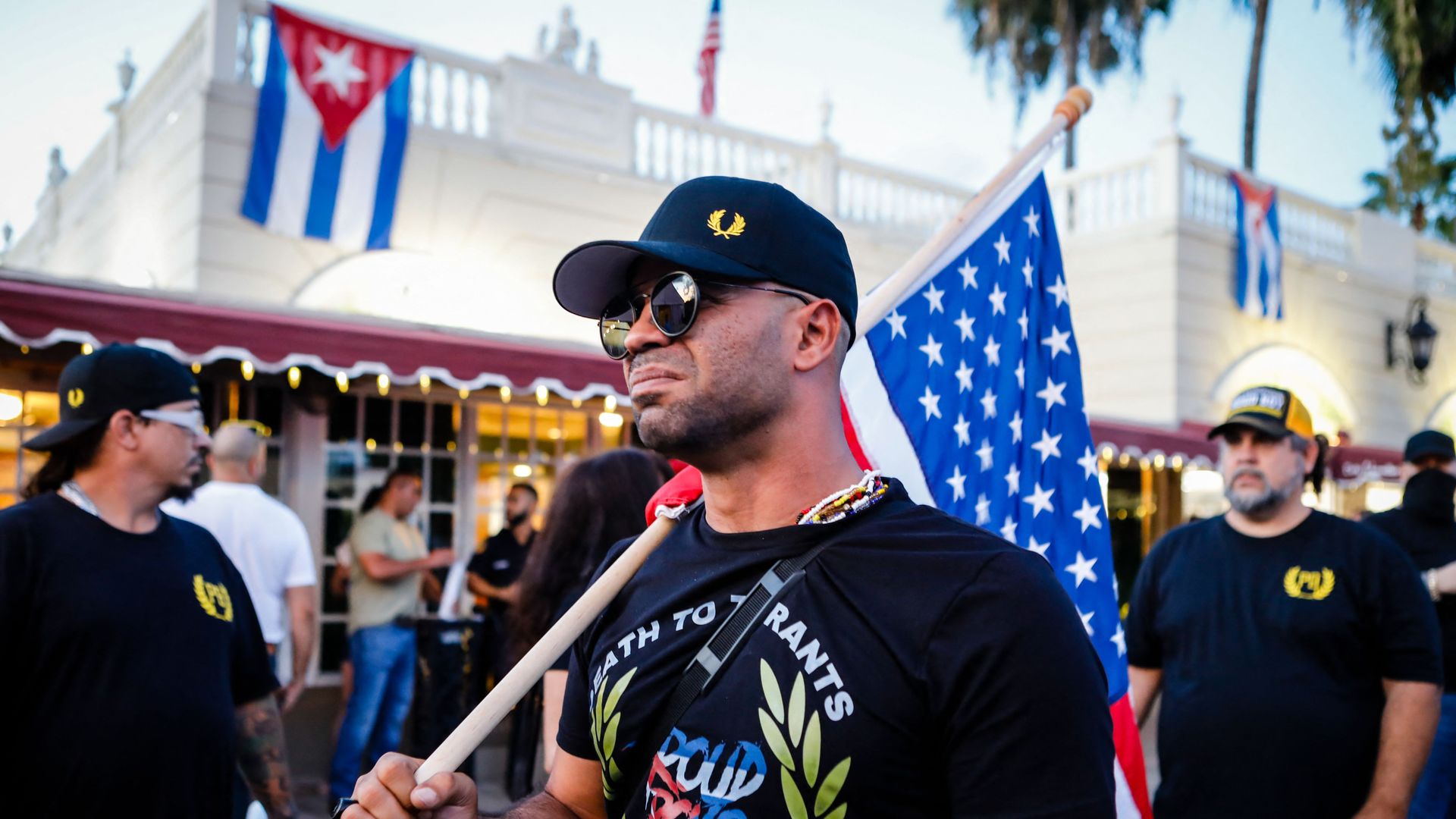 Henry "Enrique" Tarrio, leader of The Proud Boys, holds an US flags during a protest showing support for Cubans demonstrating against their government, in Miami, Florida on July 16, 2021.