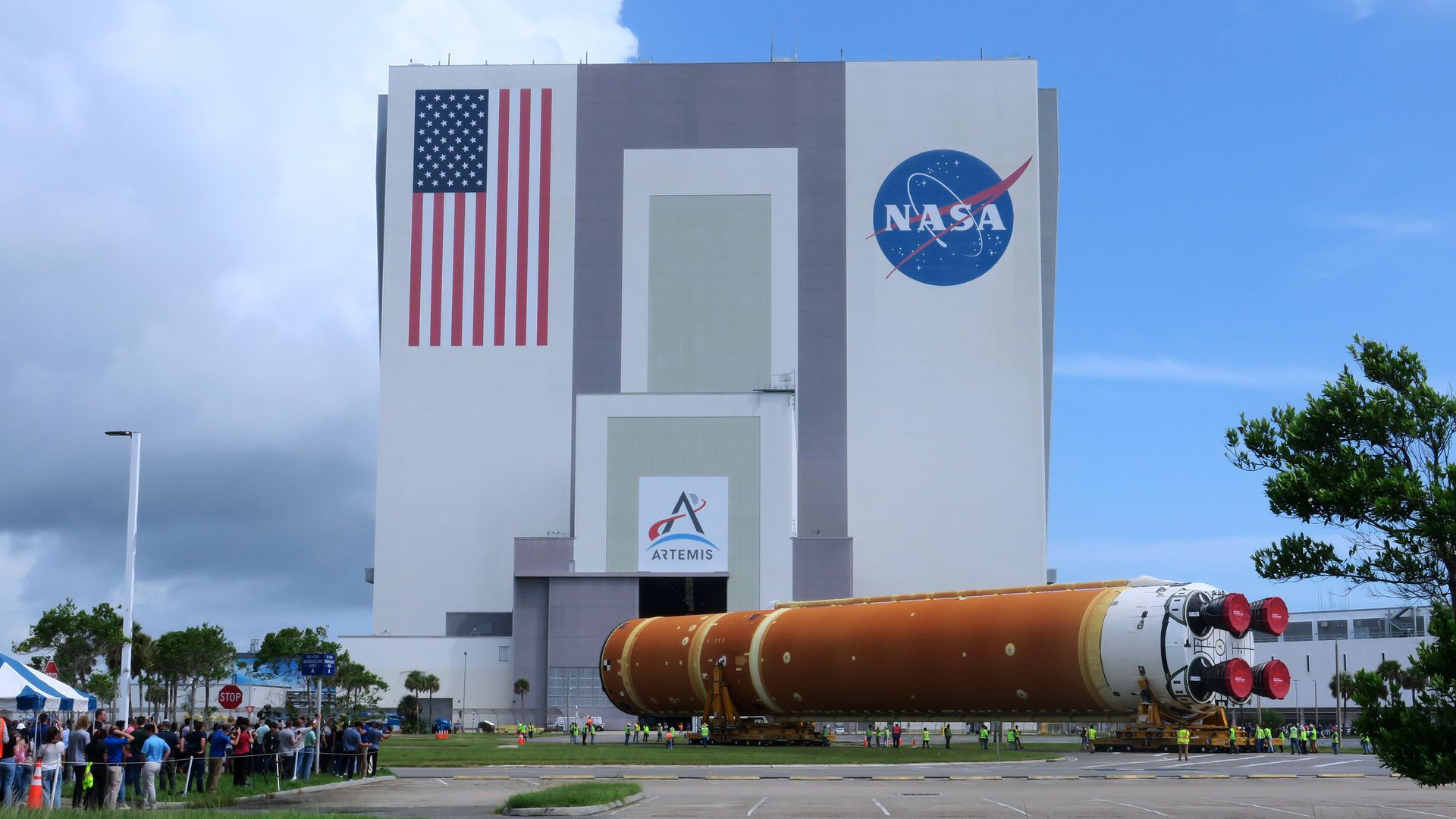 Workers transport the 212-foot-tall SLS core stage for the Artemis II moon rocket from the Pegasus barge (not shown) to the nearby Vehicle Assembly Building at NASA's Kennedy Space Center on July 24, 2024 in Cape Canaveral, Florida. (Photo by Paul Hennessy/Anadolu via Getty Images)