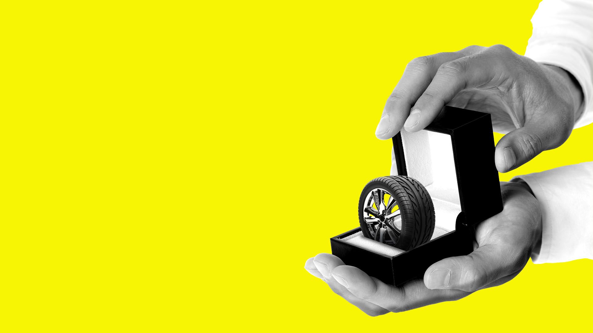 Illustration of someone presenting an engagement box with a tire in it