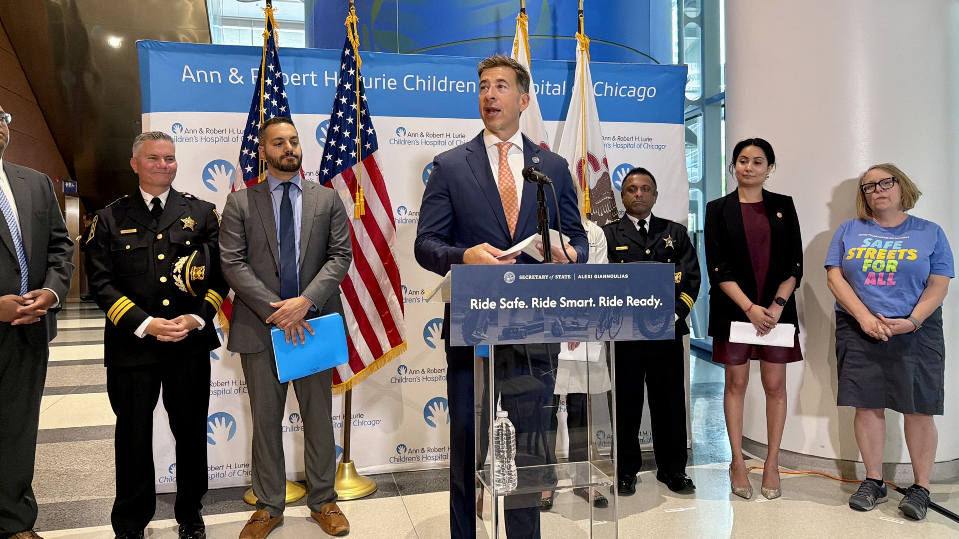 man in a suit at a podium