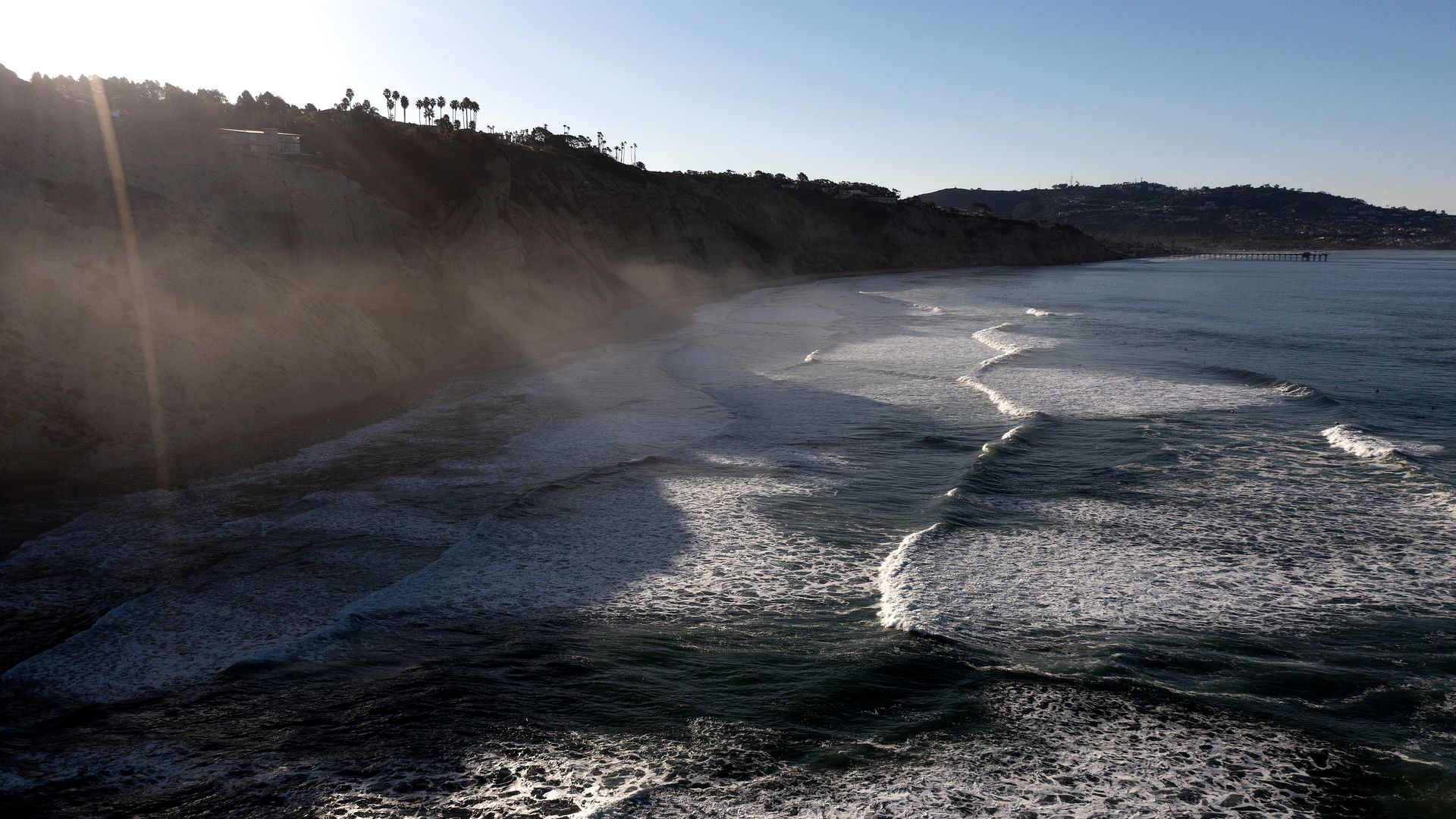A dramatic, steep cliff falling into the Pacific Ocean
