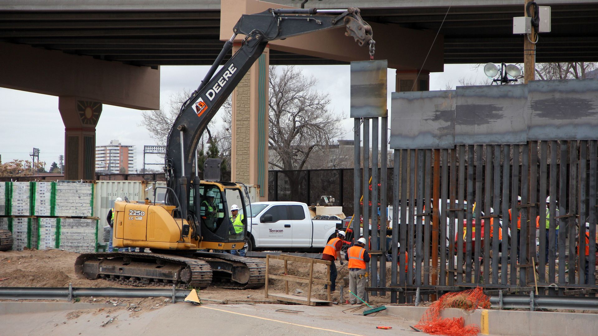 Workers building border wall