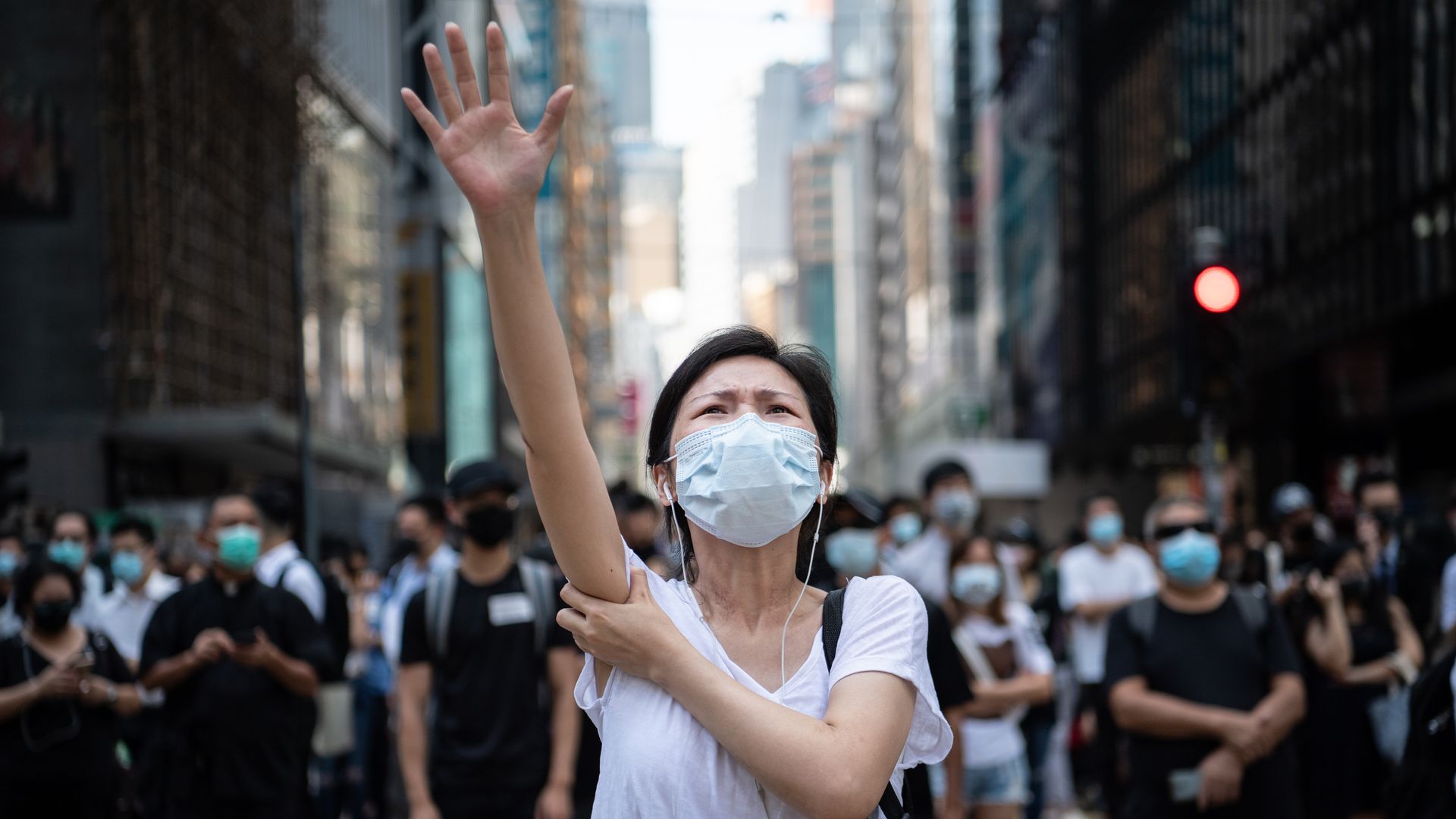 Photo of a Hong Kong protester wearing a medical mask on her face
