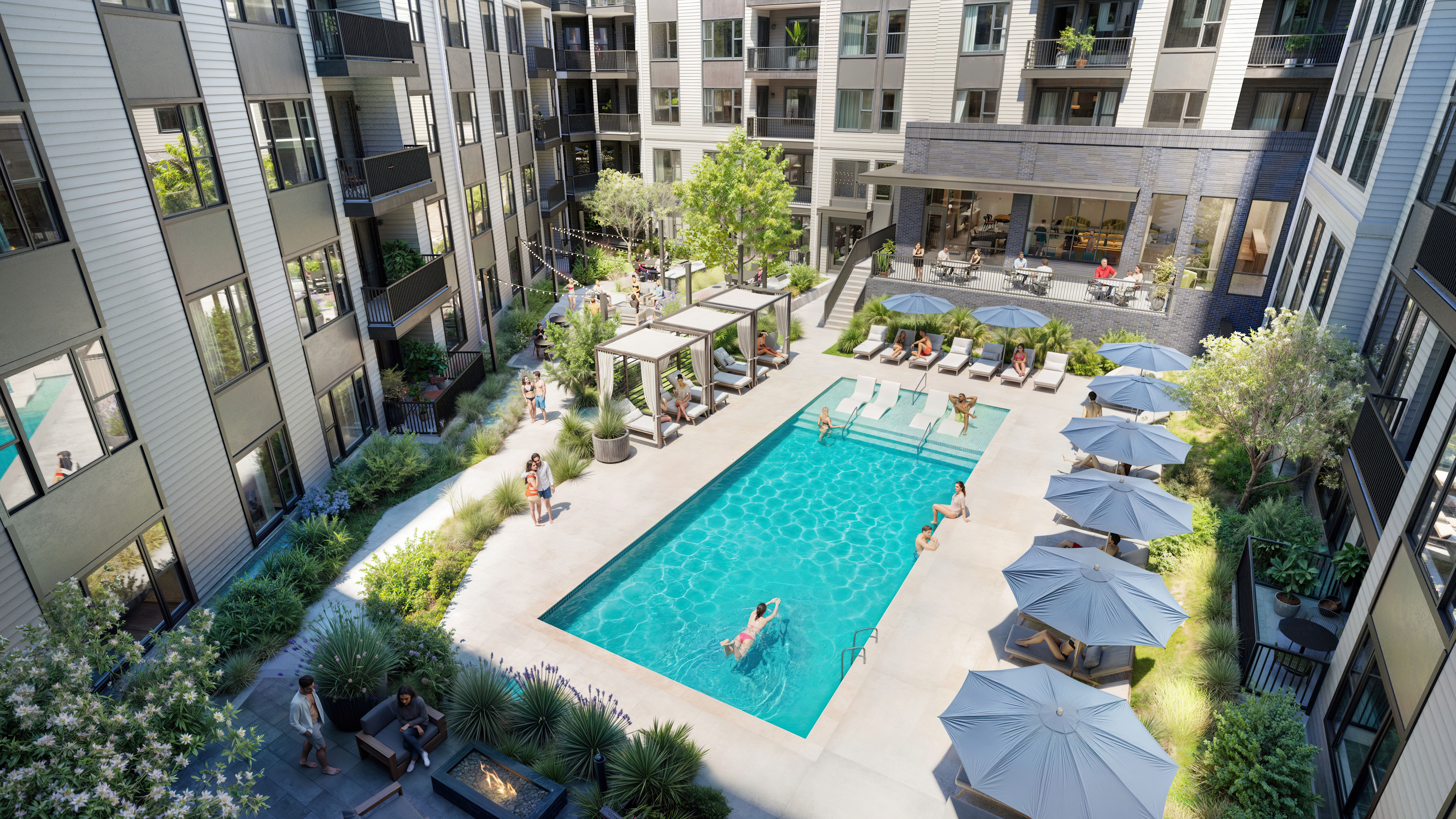 A modern apartment courtyard with a rectangular blue swimming pool, people swimming and lounging under blue umbrellas and white cabanas, surrounded by multi-story buildings and greenery.