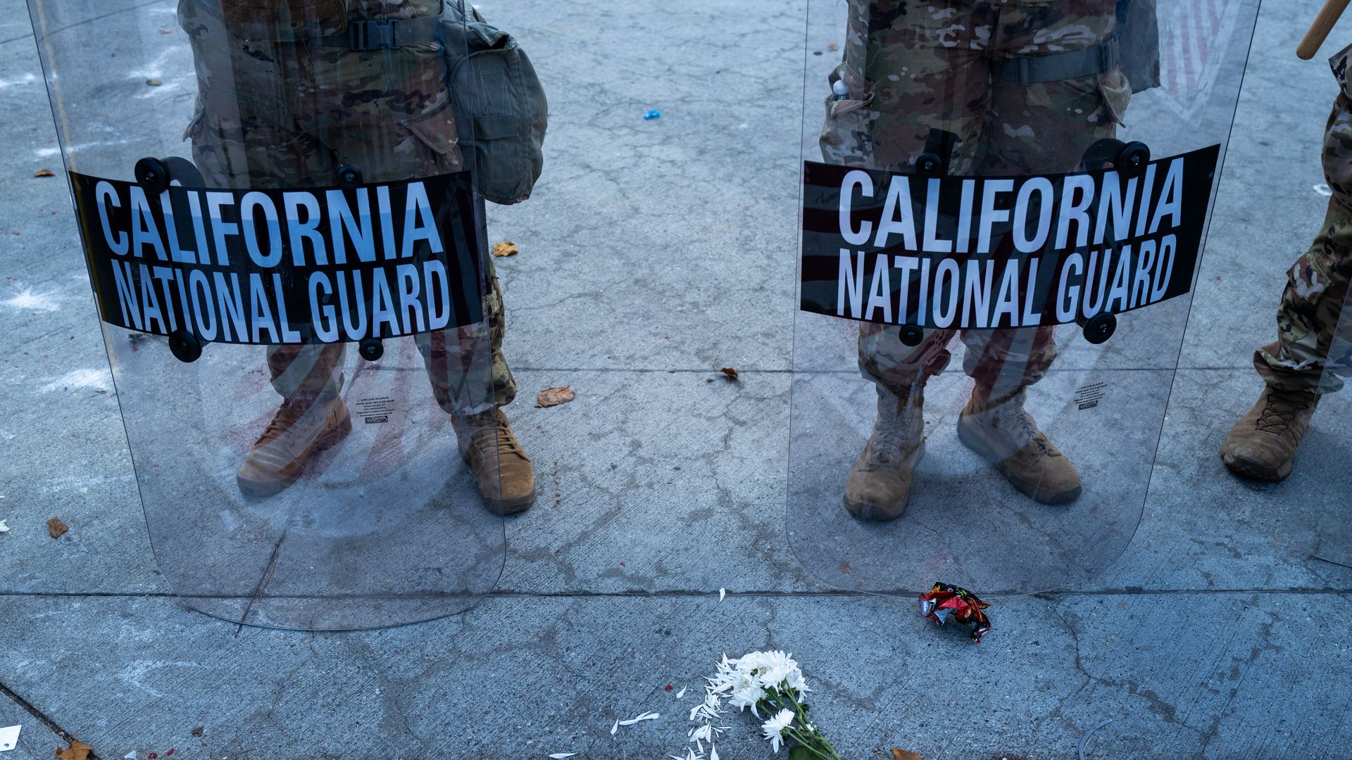 Two California National Guard members with shields 