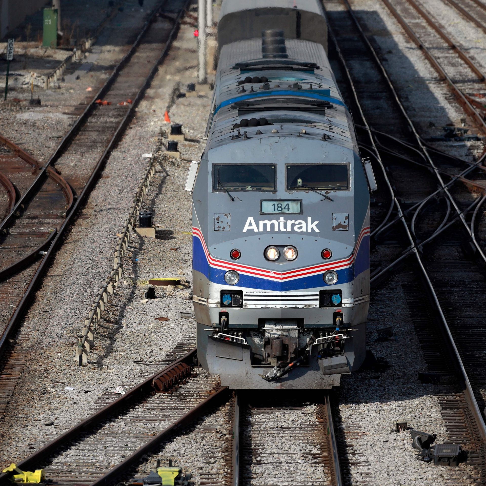An Amtrak train departing a station. An Amtrak train departing a station. 