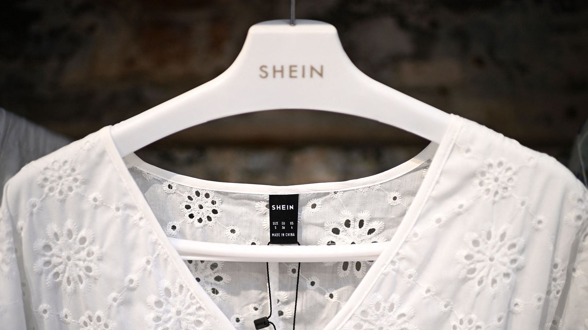 Shein logo on a clothes hangar. 