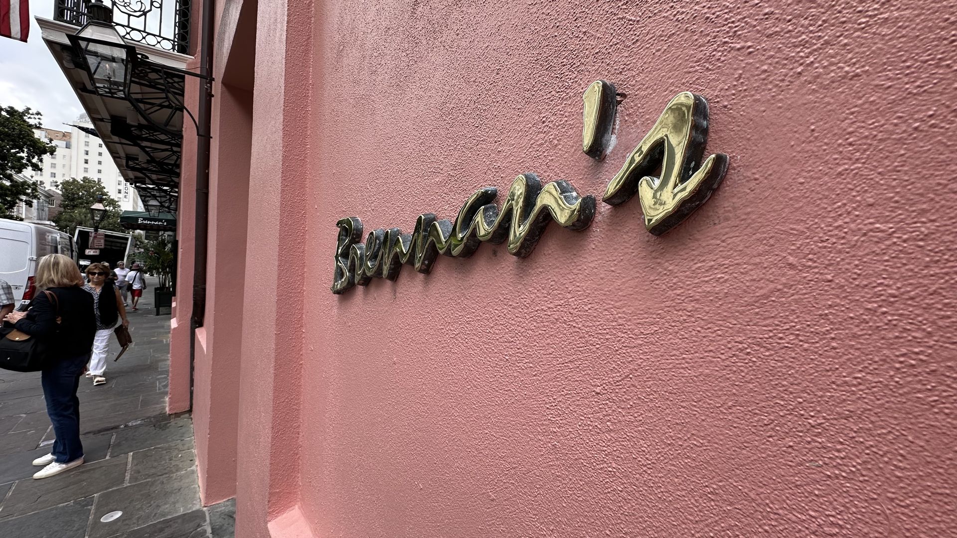 A photo of the Brennan's sign on a pink wall. 