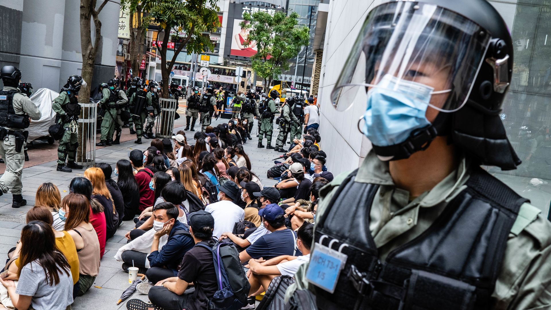 Riot police round up a group of protesters during the demonstration. 
