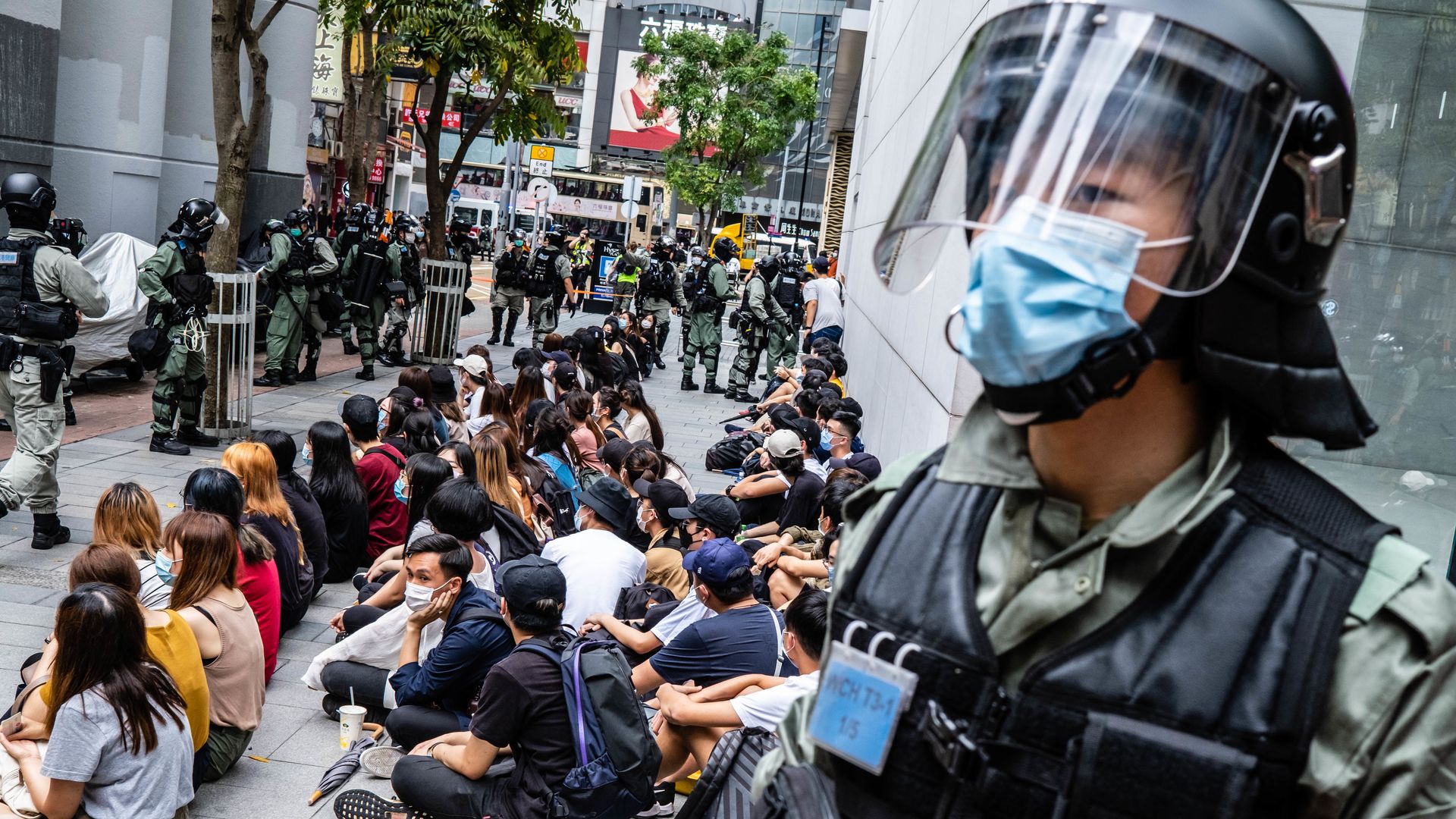 Riot police round up a group of protesters during the demonstration.