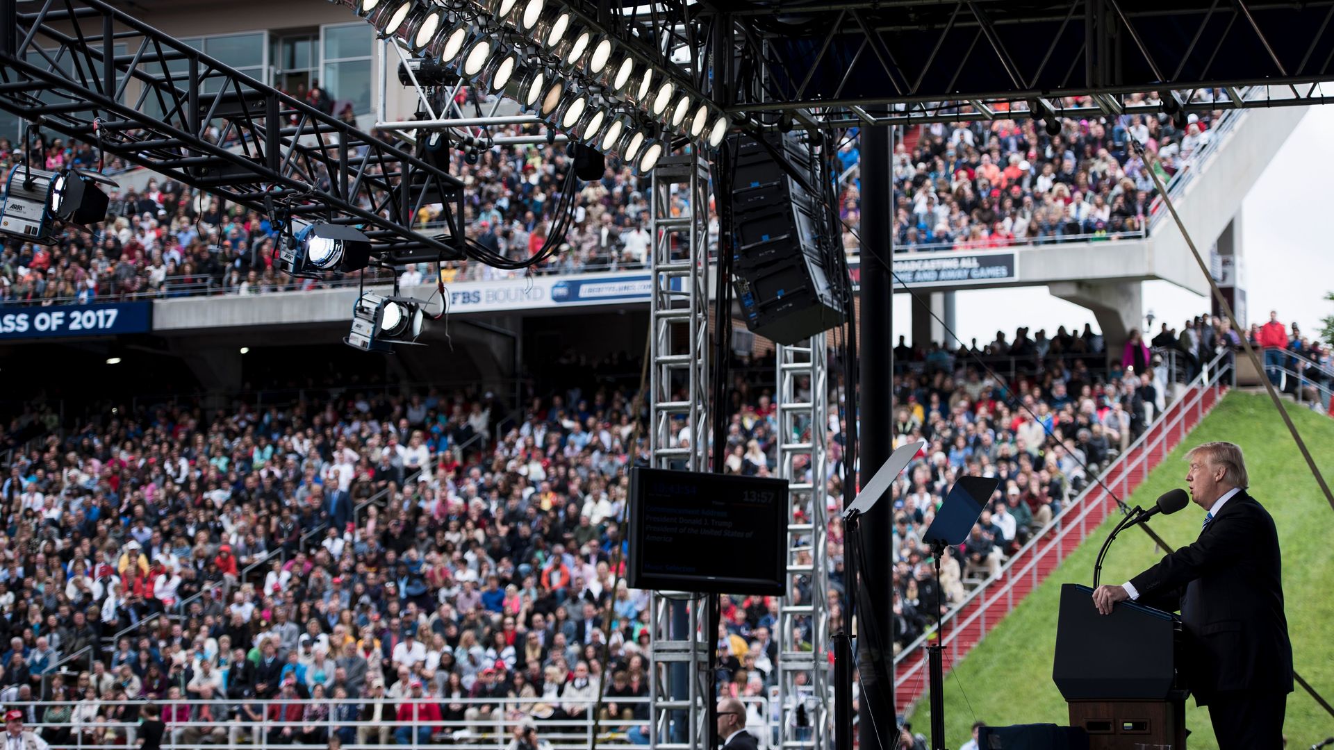 Trump on stage, facing crowd