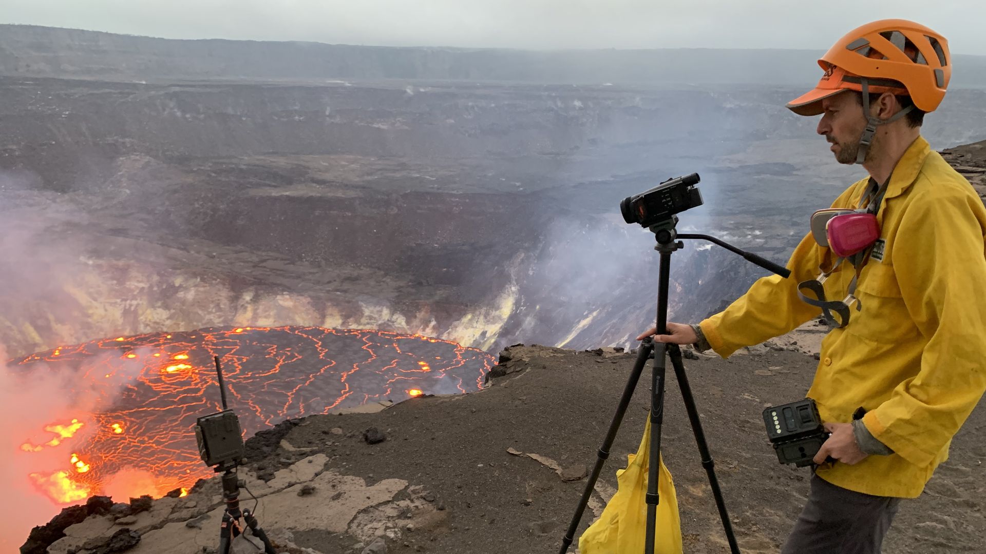 A USGS Hawaiian Volcano Observatory geologist recording the eruption at Halemaumau crater on Sept. 29.