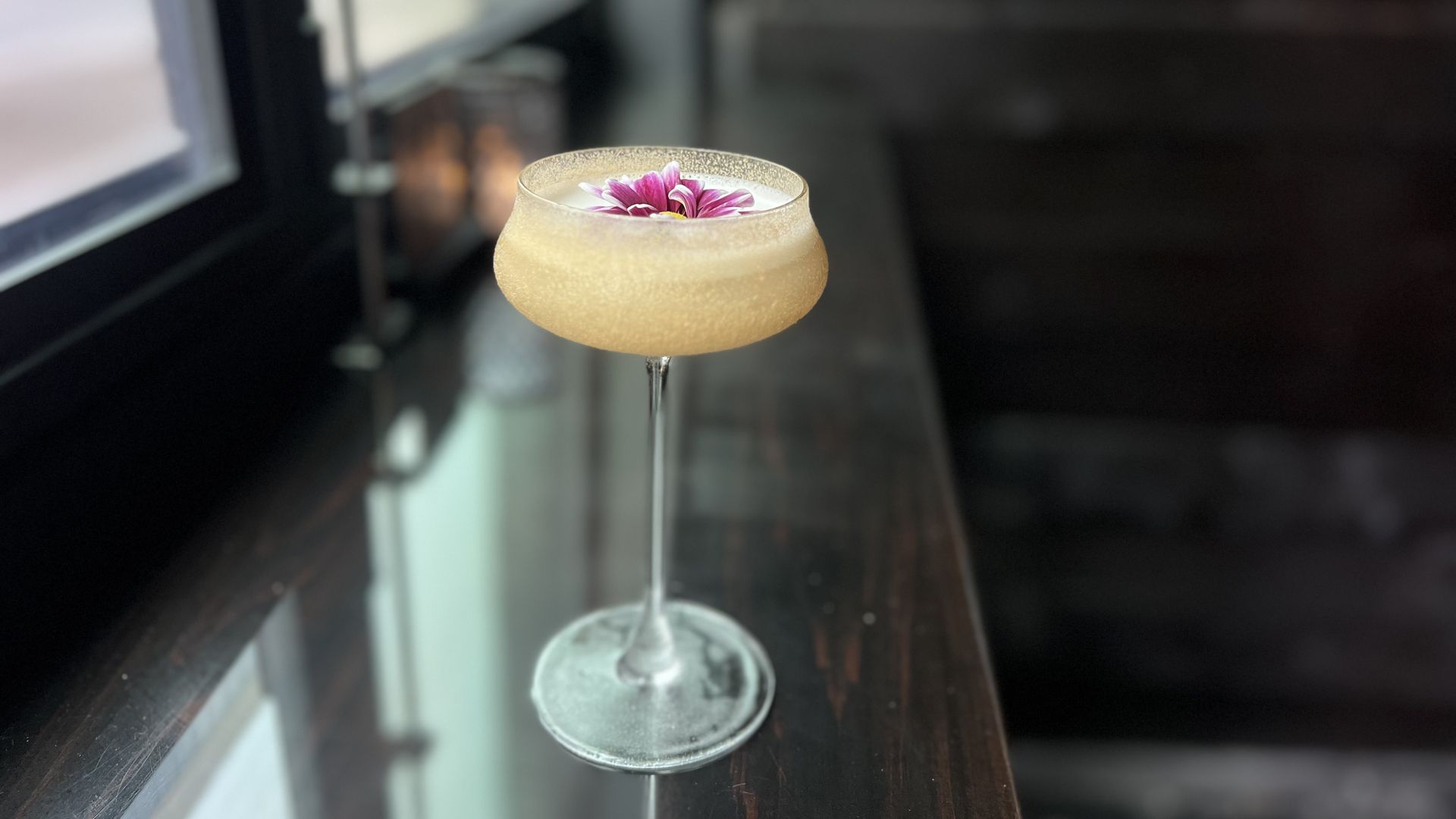 A photo of a drink on a bar