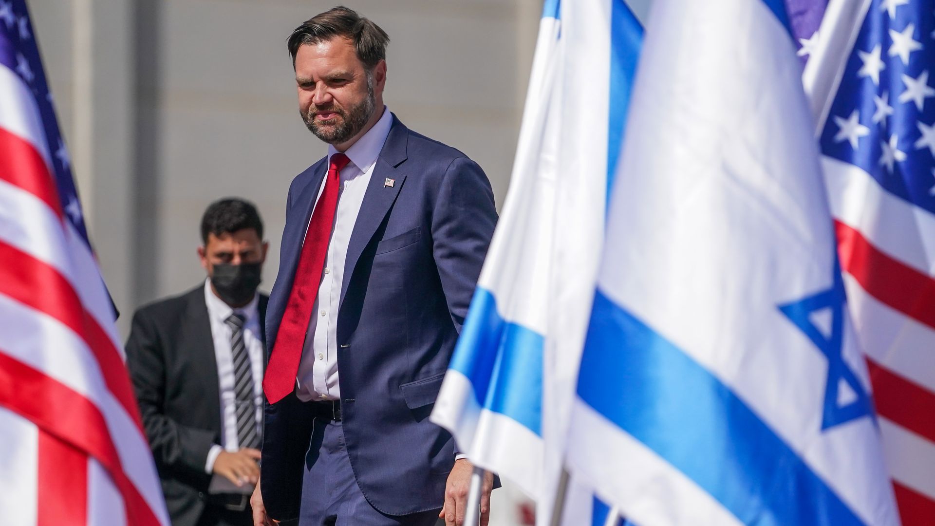 Vice President JD Vance is shown with an Israel flag in the foreground.