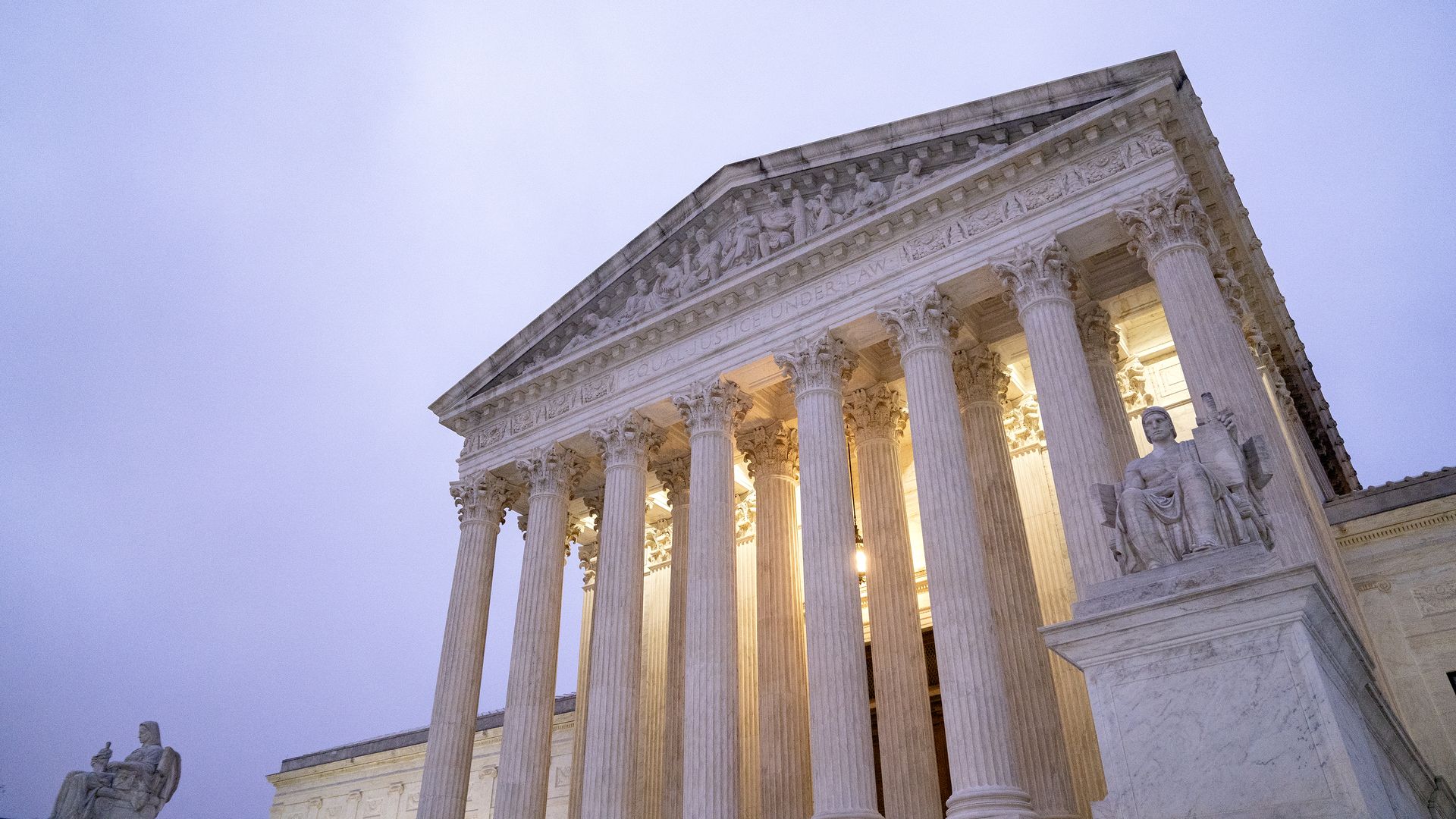 Photo of the U.S. Supreme Court building against a violet sky