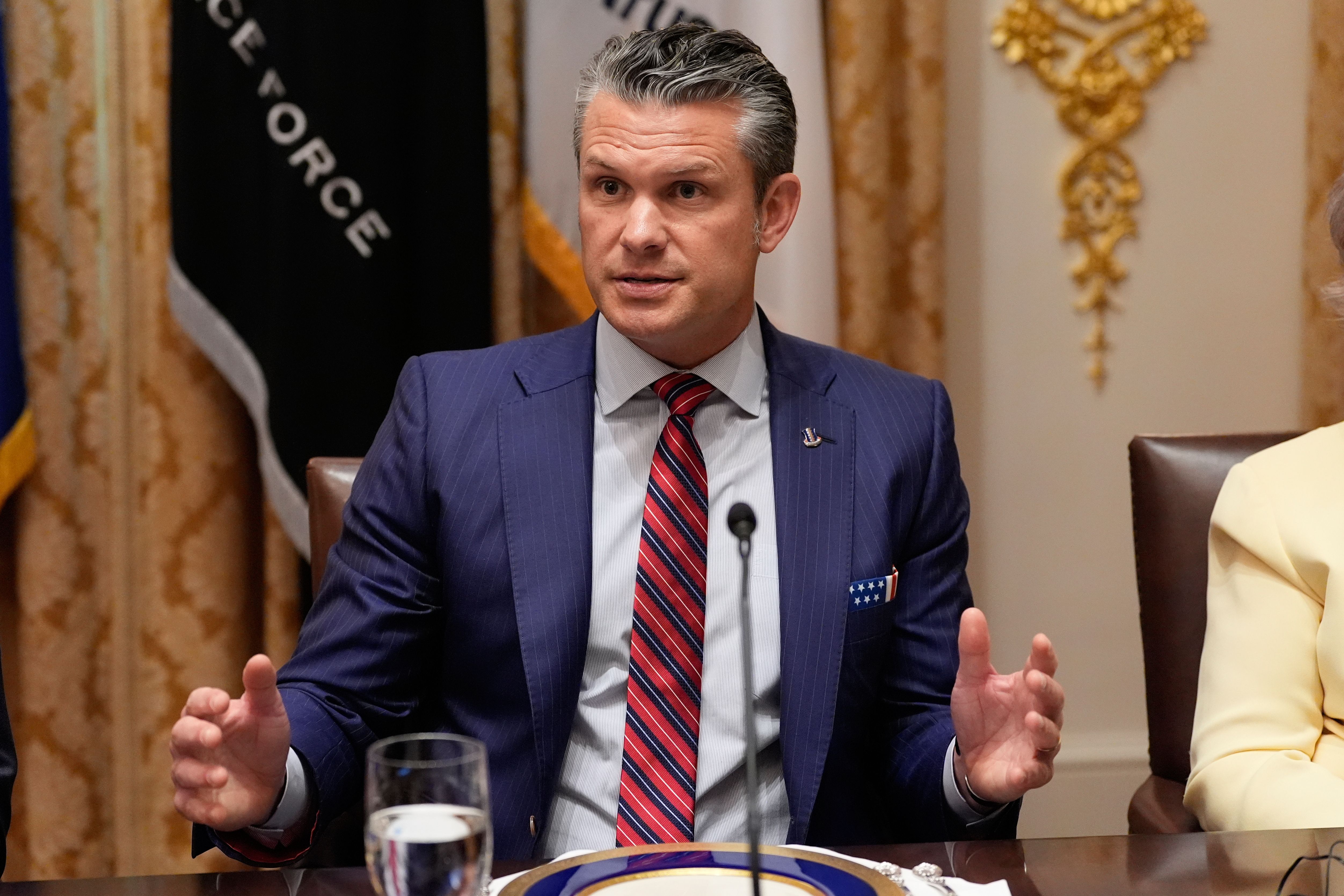 Defense Secretary Pete Hegseth speaks during a meeting with President Donald Trump and Argentina's President Javier Milei in the Cabinet Room of the White House, Tuesday, Oct. 14, 2025, in Washington. (AP Photo/Alex Brandon)