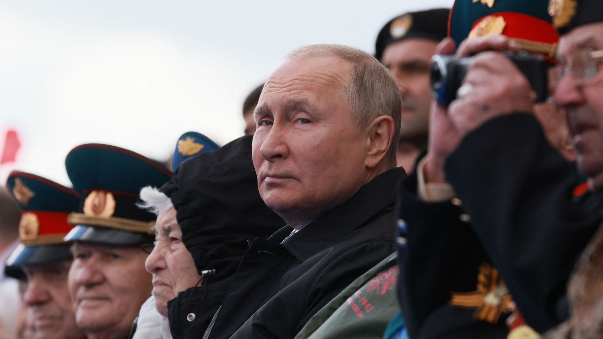 Putin watching military parade