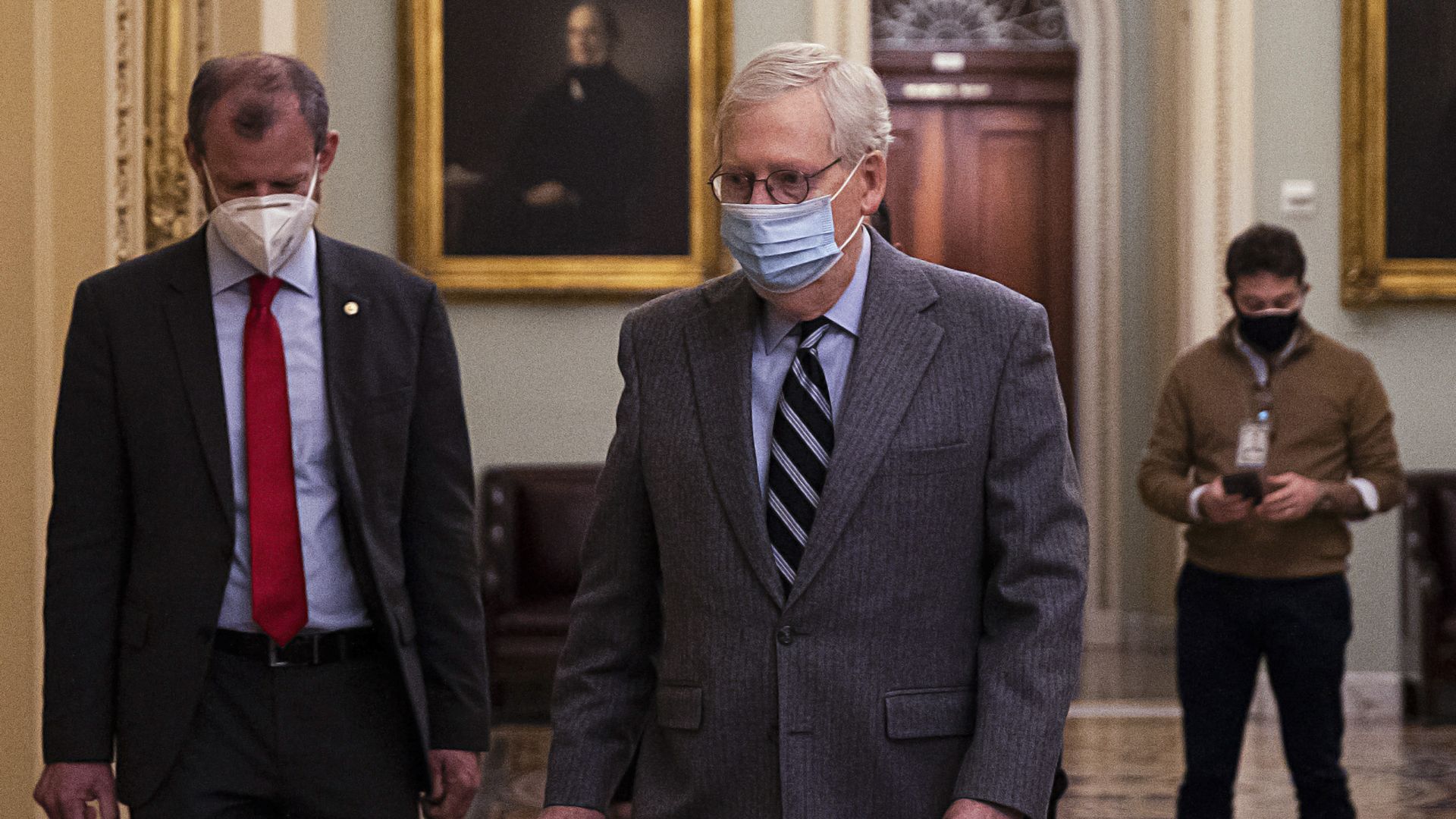 Senate Majority Leader Mitch McConnell walks through the Capitol today.