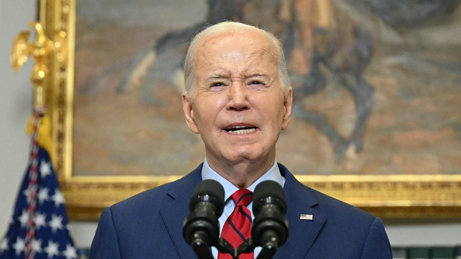 Biden in blue suit and red tie