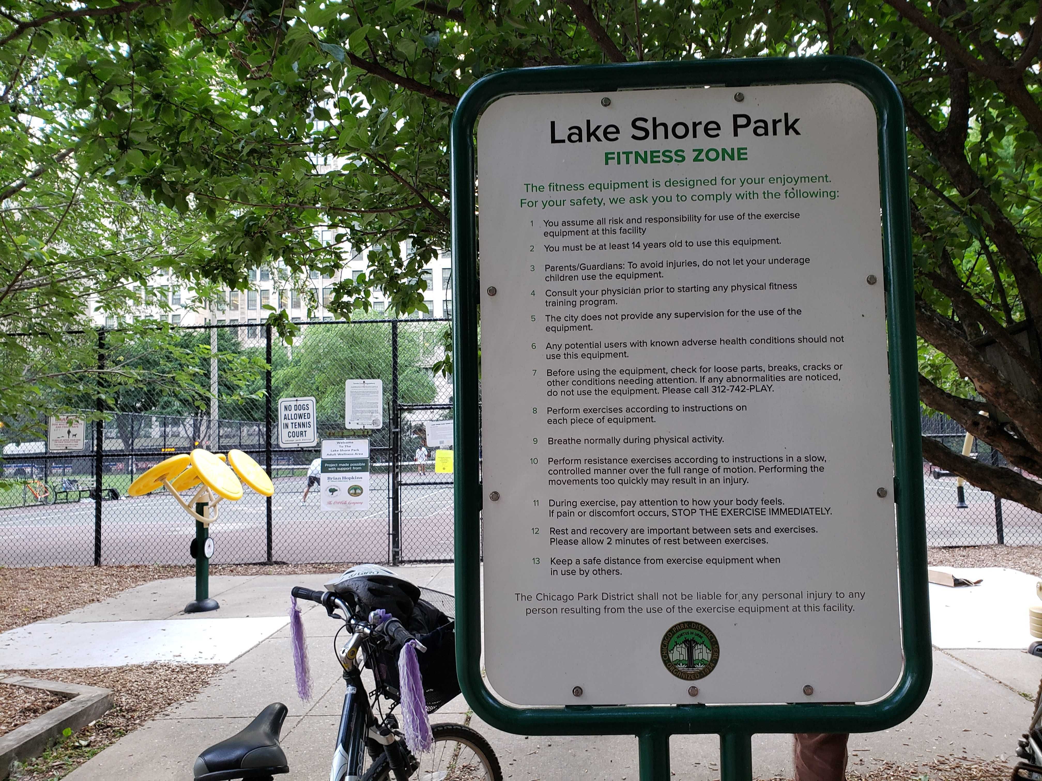 Photo of sign with rules at entrance to park. 