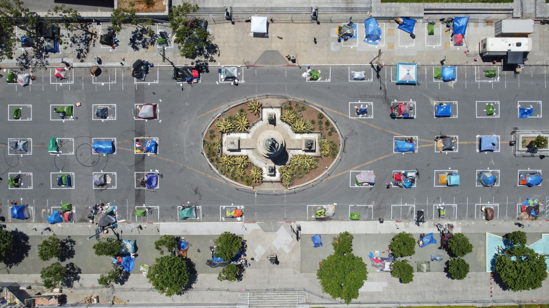 Aerial view showing tidy rows of tents 