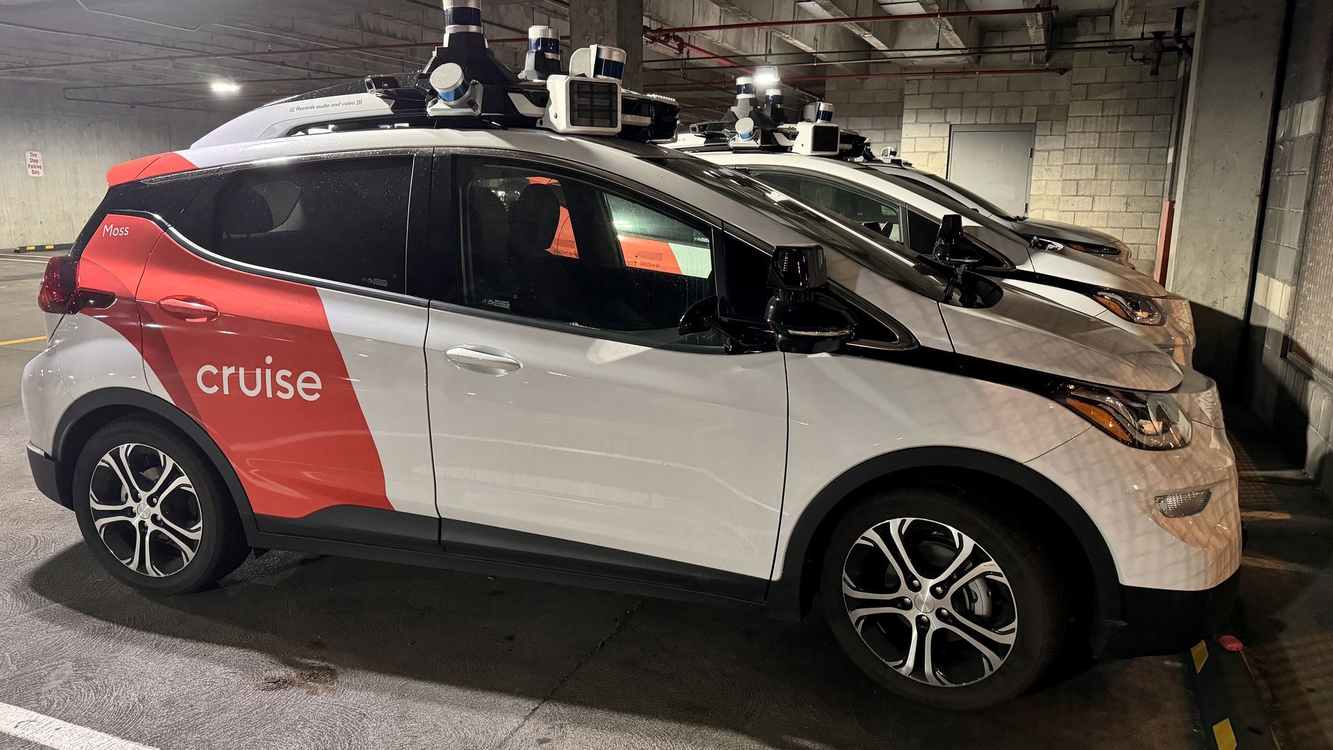 A Cruise robotaxi in a parking garage.
