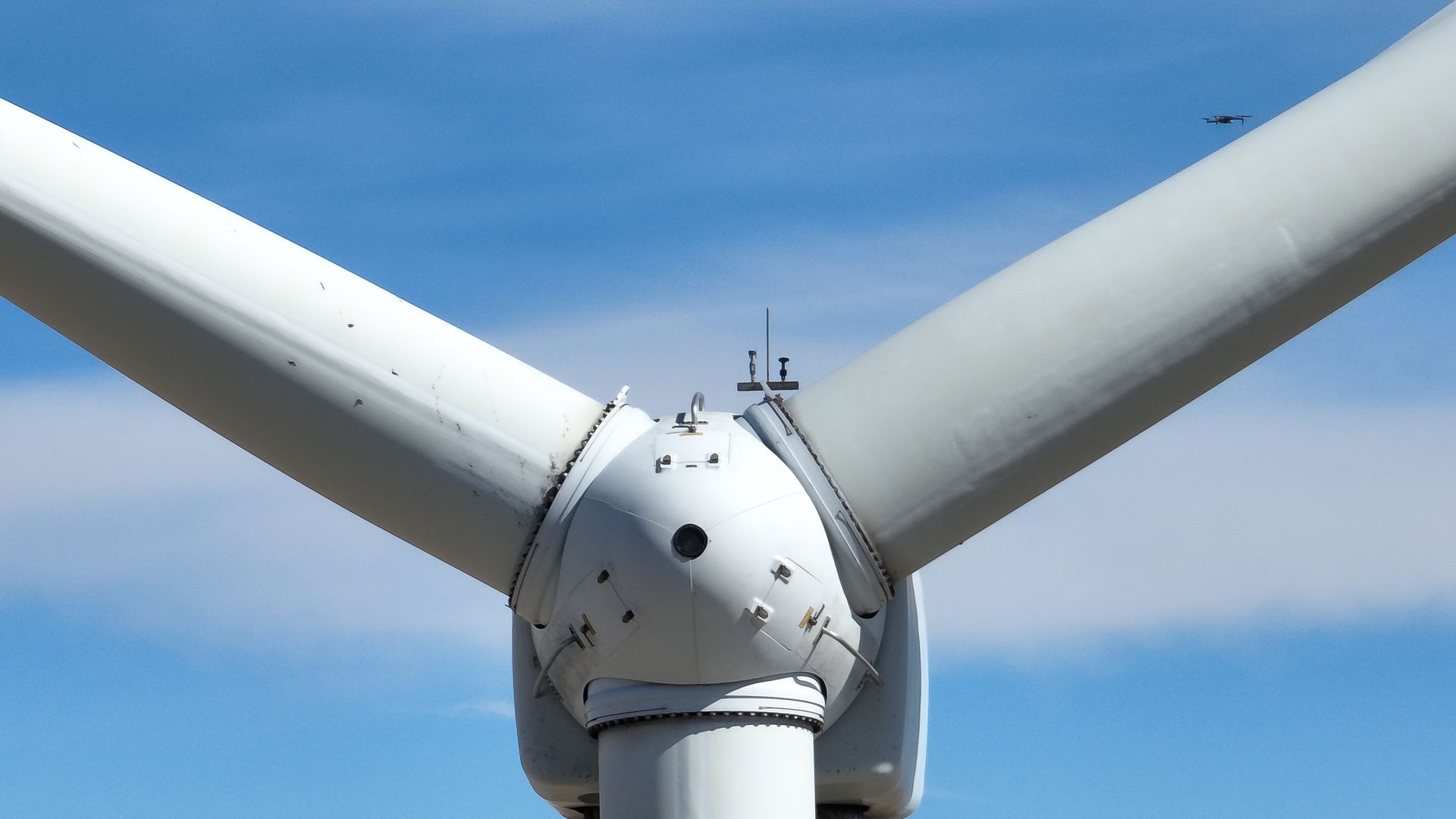 A Zeitview drone inspects a wind turbine.