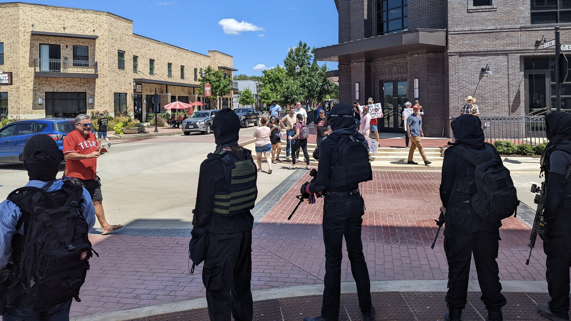 Armed counter-protesters face protesters