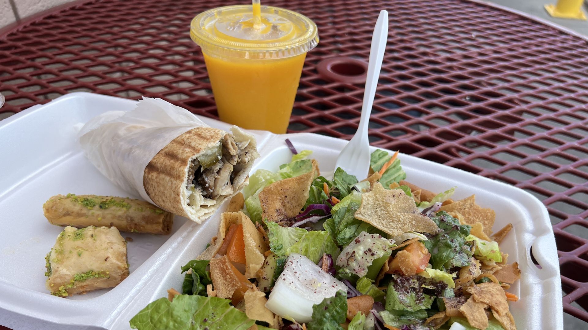 Boostan Cafe's chicken shawarma sandwich, fattoush salad and baklava.