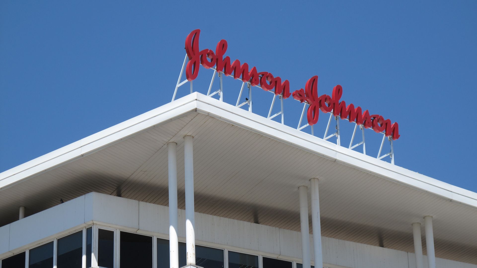 Johnson & Johnson logo on top of a building.