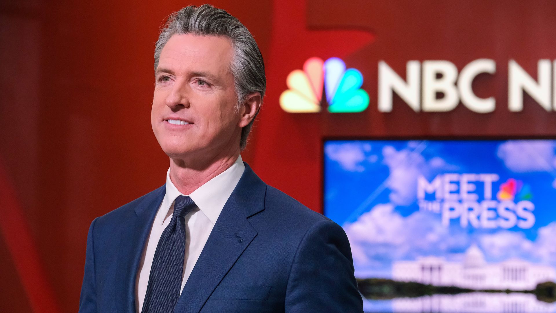 Gavin Newsom with an NBC sign in the background.