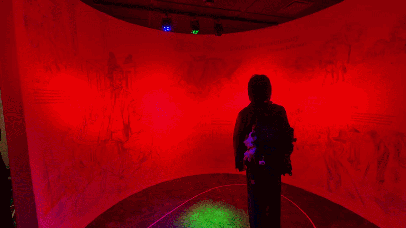 a video of a person stepping on different colors. with each color, the exhibit around him changes 