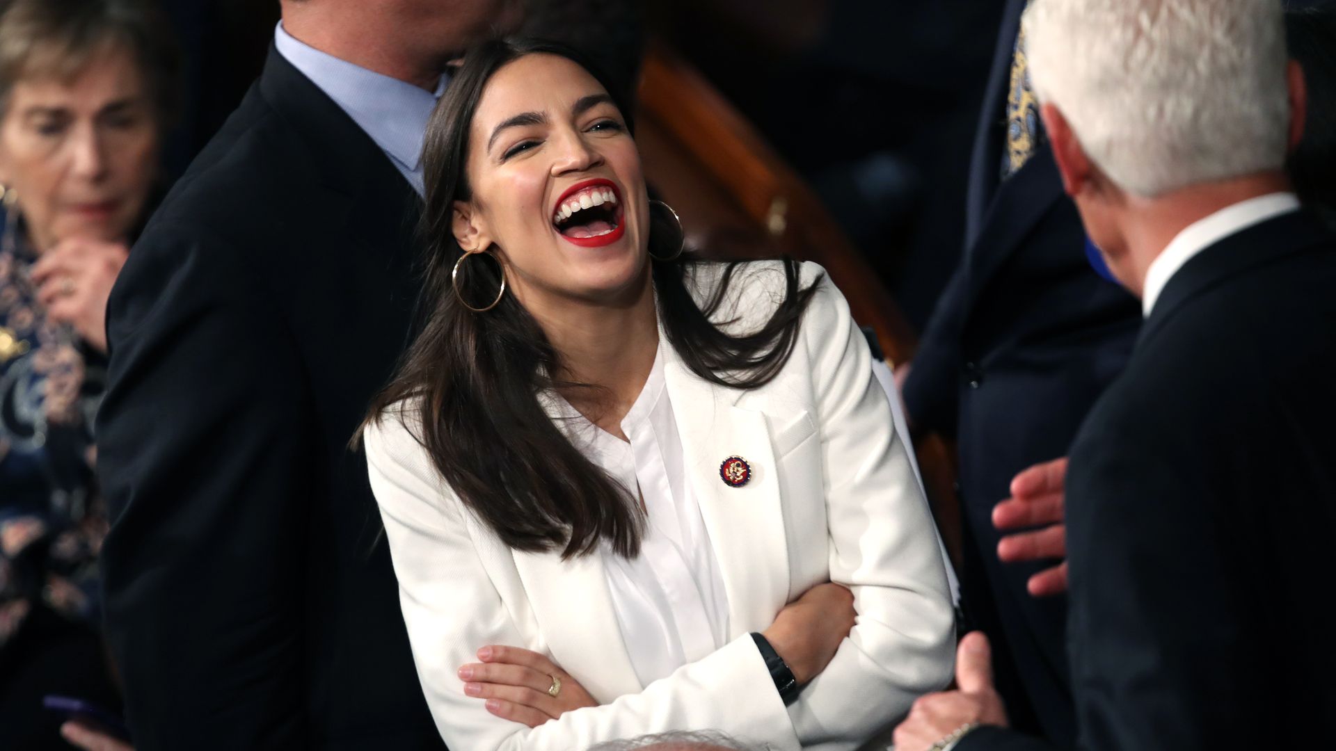 Alexandria Ocasio-Cortez laughs. 