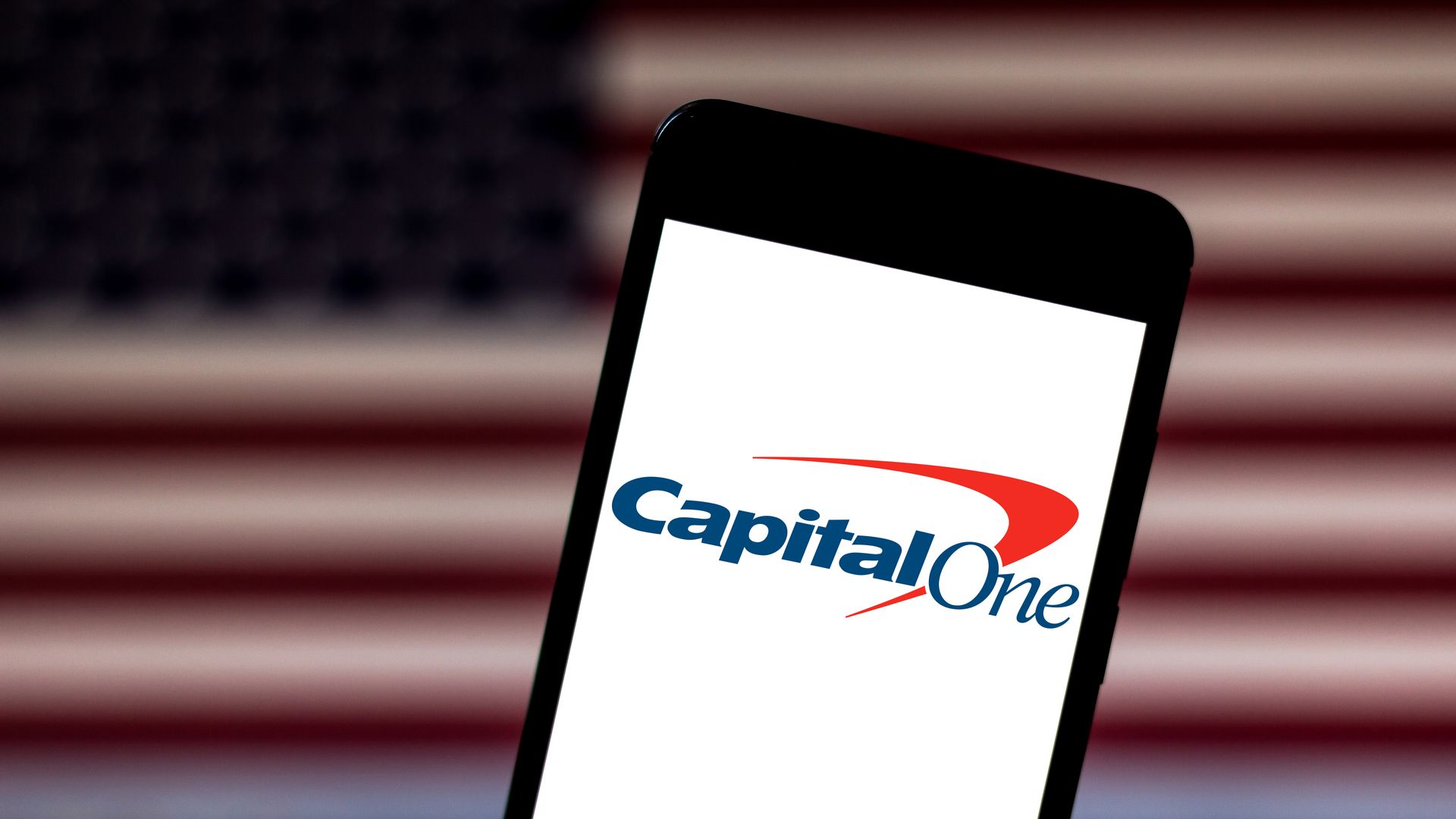 Capital One's logo displayed on a phone. 