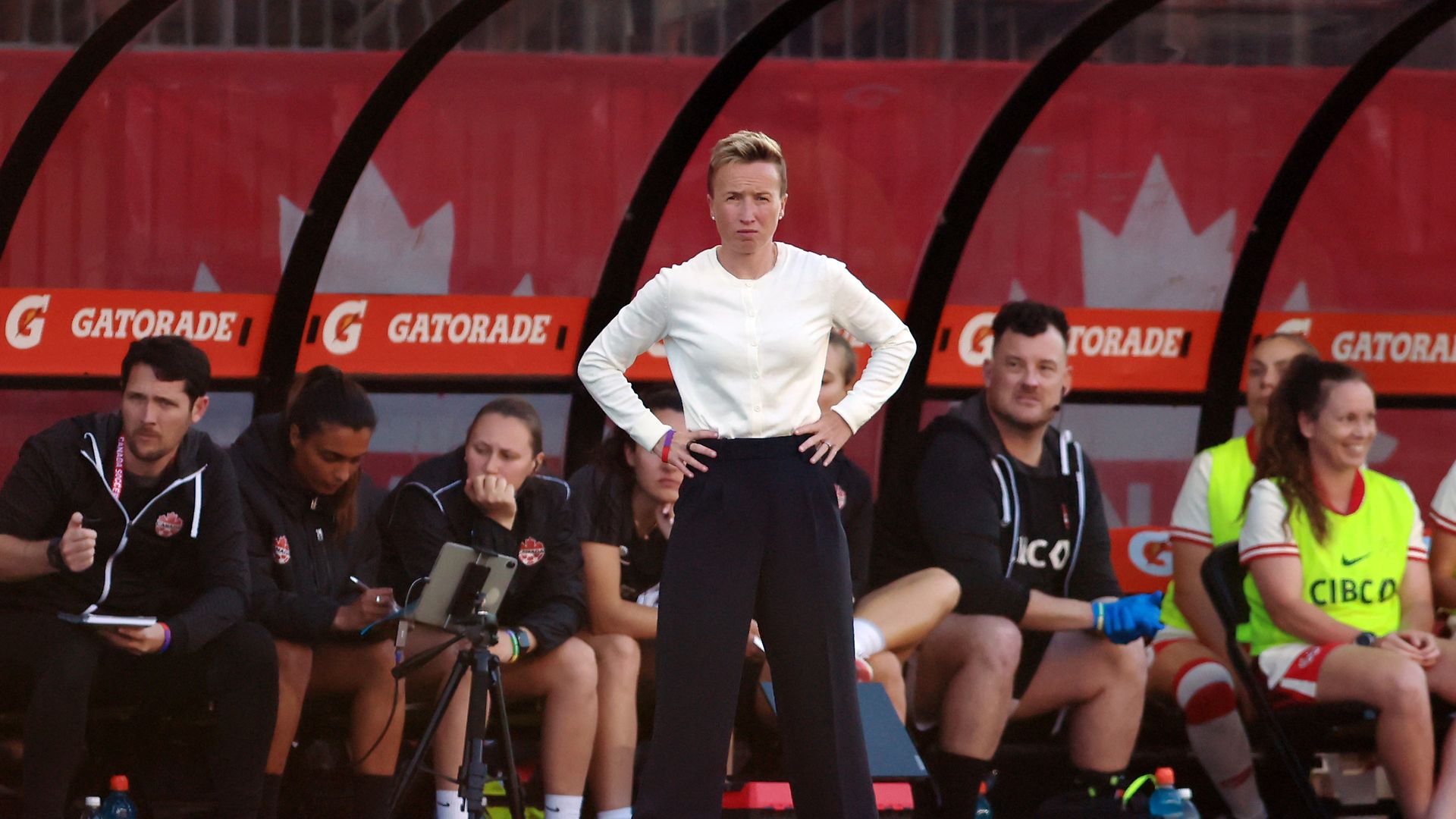 Bev Priestman stands at match against Mexico at BMO Field 