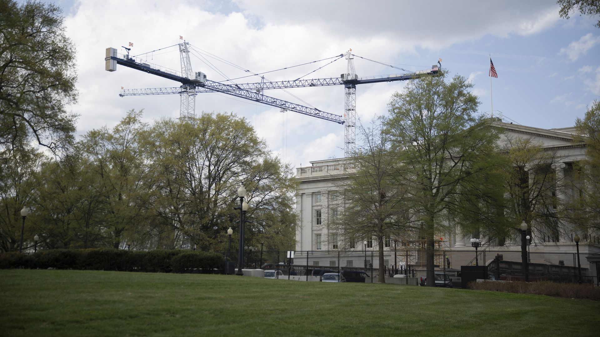 Construction cranes stand near the White House on April 1, 2026.