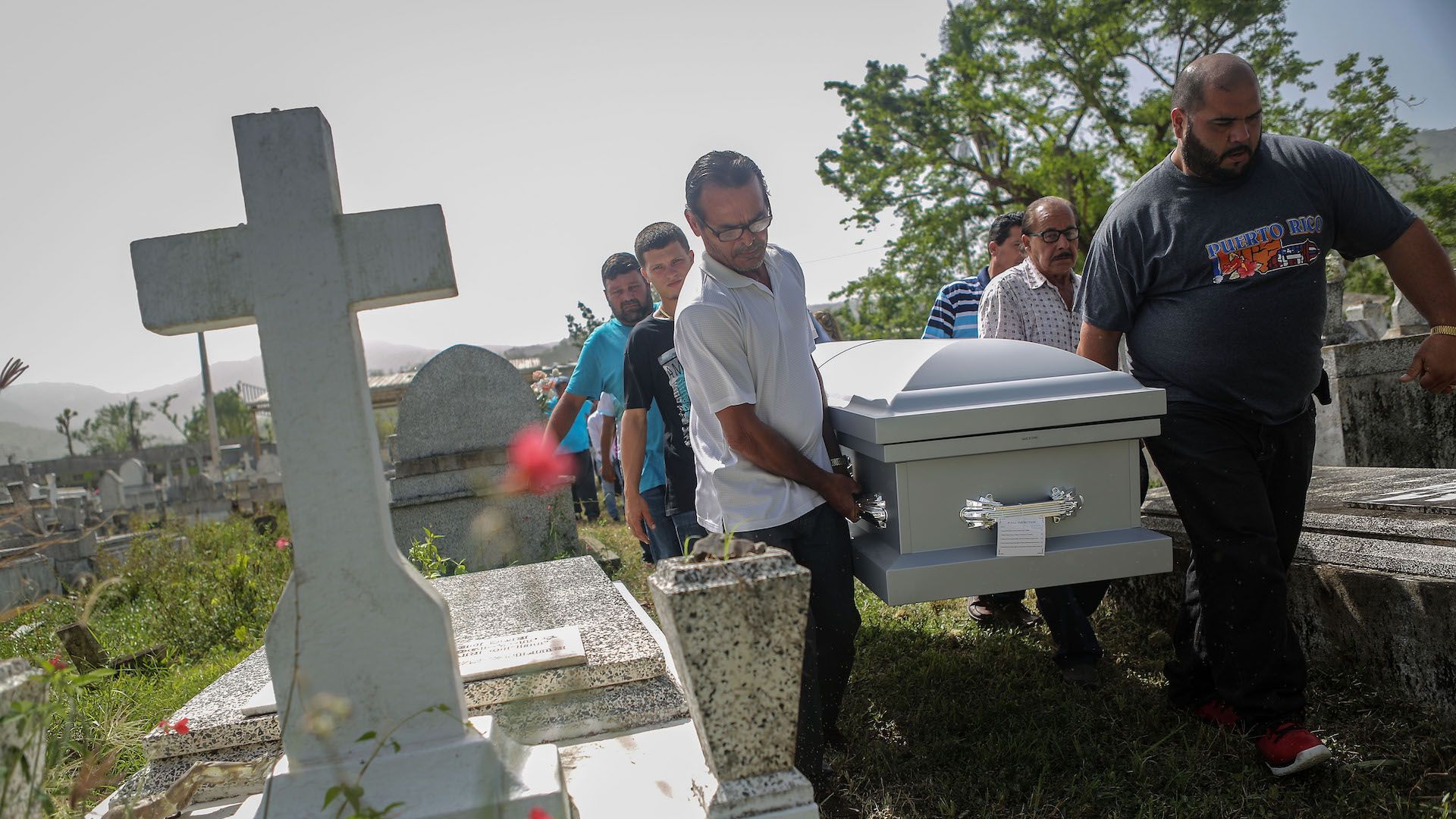 Mourners carry the casket of Wilfredo Torres Rivera, 58, who died October 13 in Puerto Rico following Hurricane Maria. 