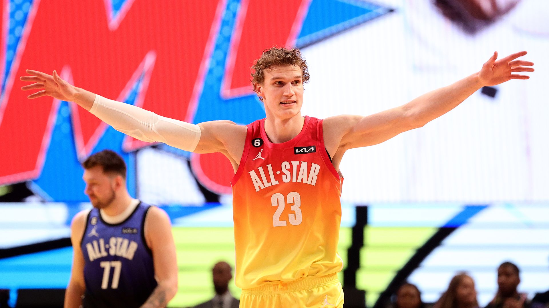 Lauri Markkanen #23 of the Utah Jazz spreads his arms during a game.
