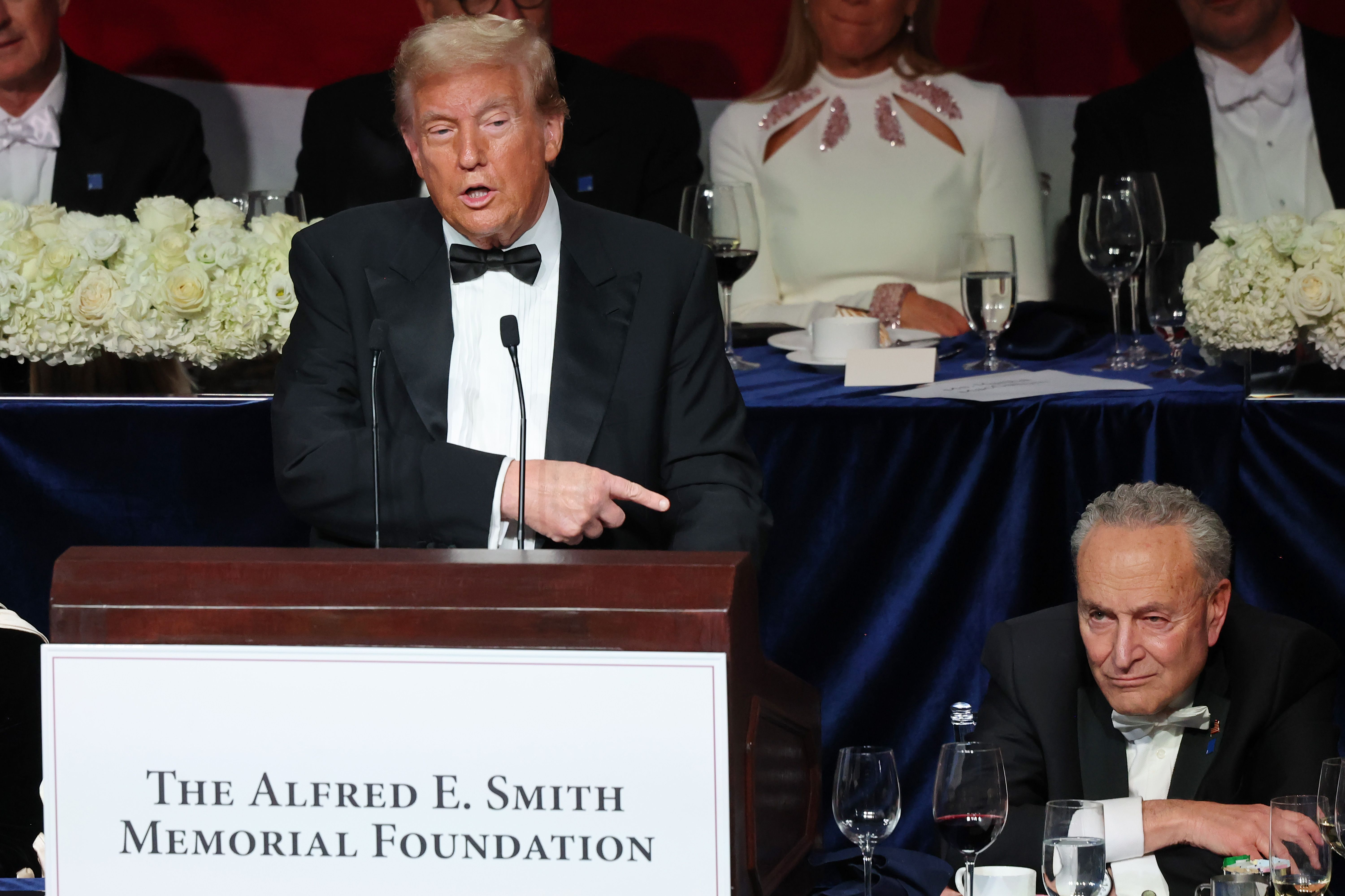 Republican presidential nominee, former U.S. President Donald Trump points to Senate Majority Leader Chuck Schumer as he speaks during the annual Alfred E. Smith Foundation Dinner at the New York Hilton Midtown on October 17, 2024 in New York City. 