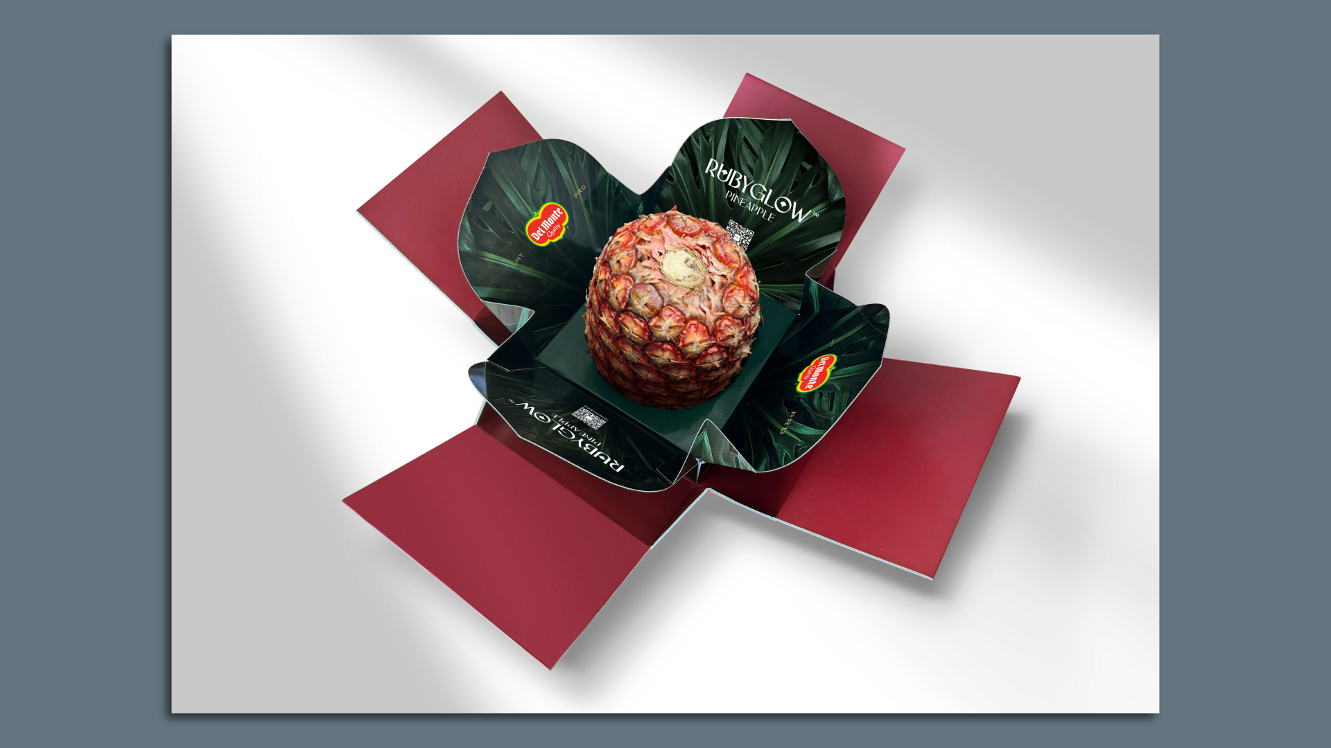 A red pineapple in green packaging