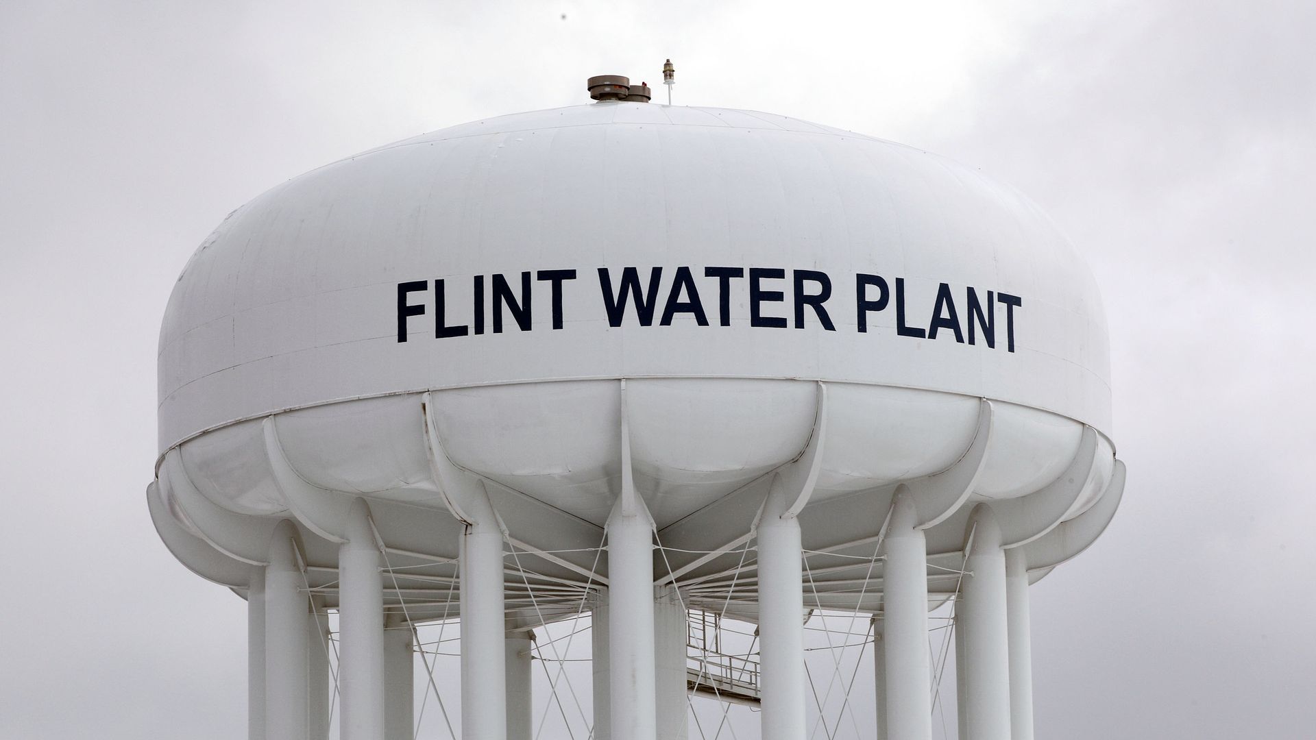 Photo of a white dome tower that says "Flint water plant" on the side