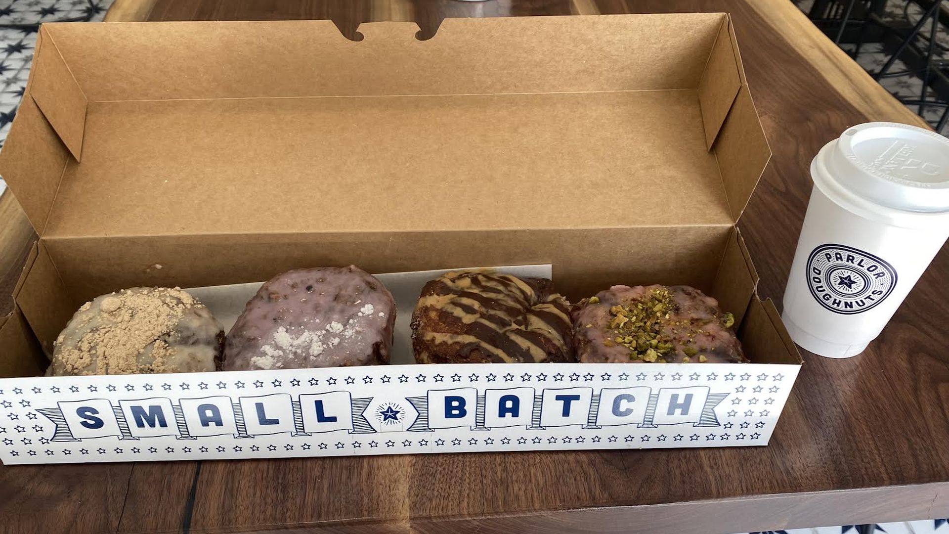 Box of doughnuts and a cup of coffee.