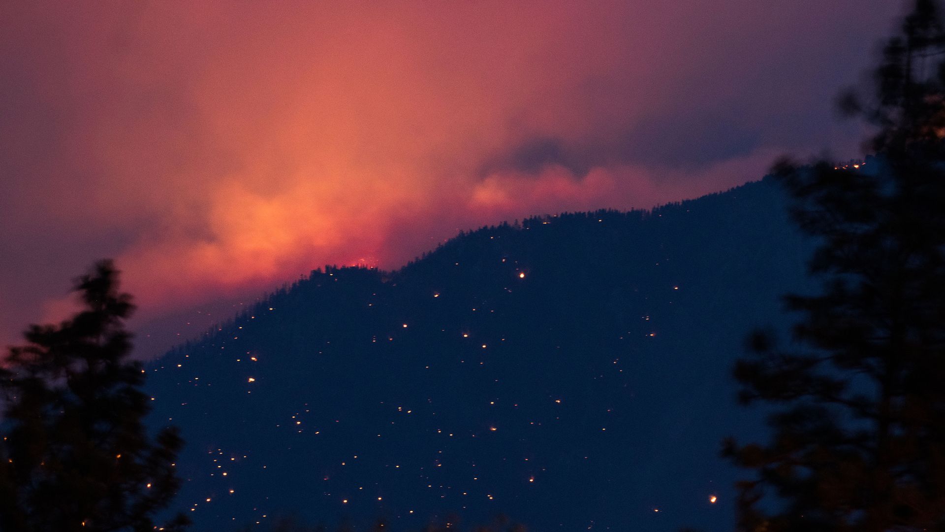A wildfire burns above the Fraser River Valley near Lytton, British Columbia, Canada, on Friday, July 2