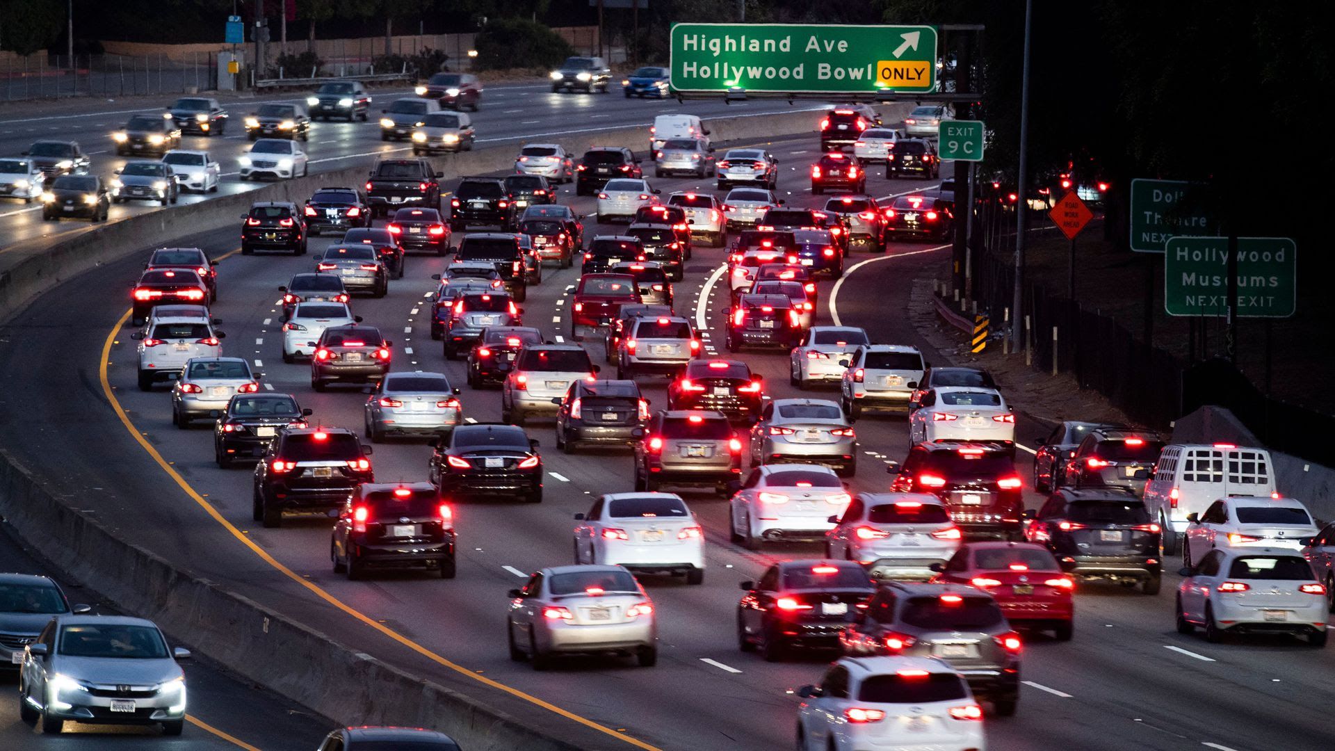 Cars going down a highway.