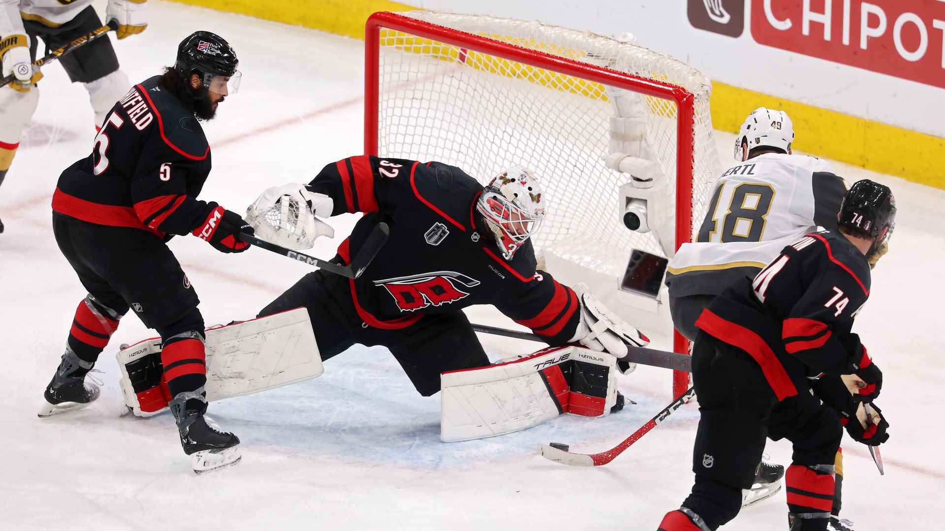 RALEIGH, NORTH CAROLINA - JUNE 11: Brandon Bussi #32 of the Carolina Hurricanes makes a save against Tomas Hertl #48 of the Vegas Golden Knights during the third period in Game Five of the 2026 Stanley Cup Final at Lenovo Center on June 11, 2026 in Raleigh, North Carolina. (Photo by Gregory Shamus/G