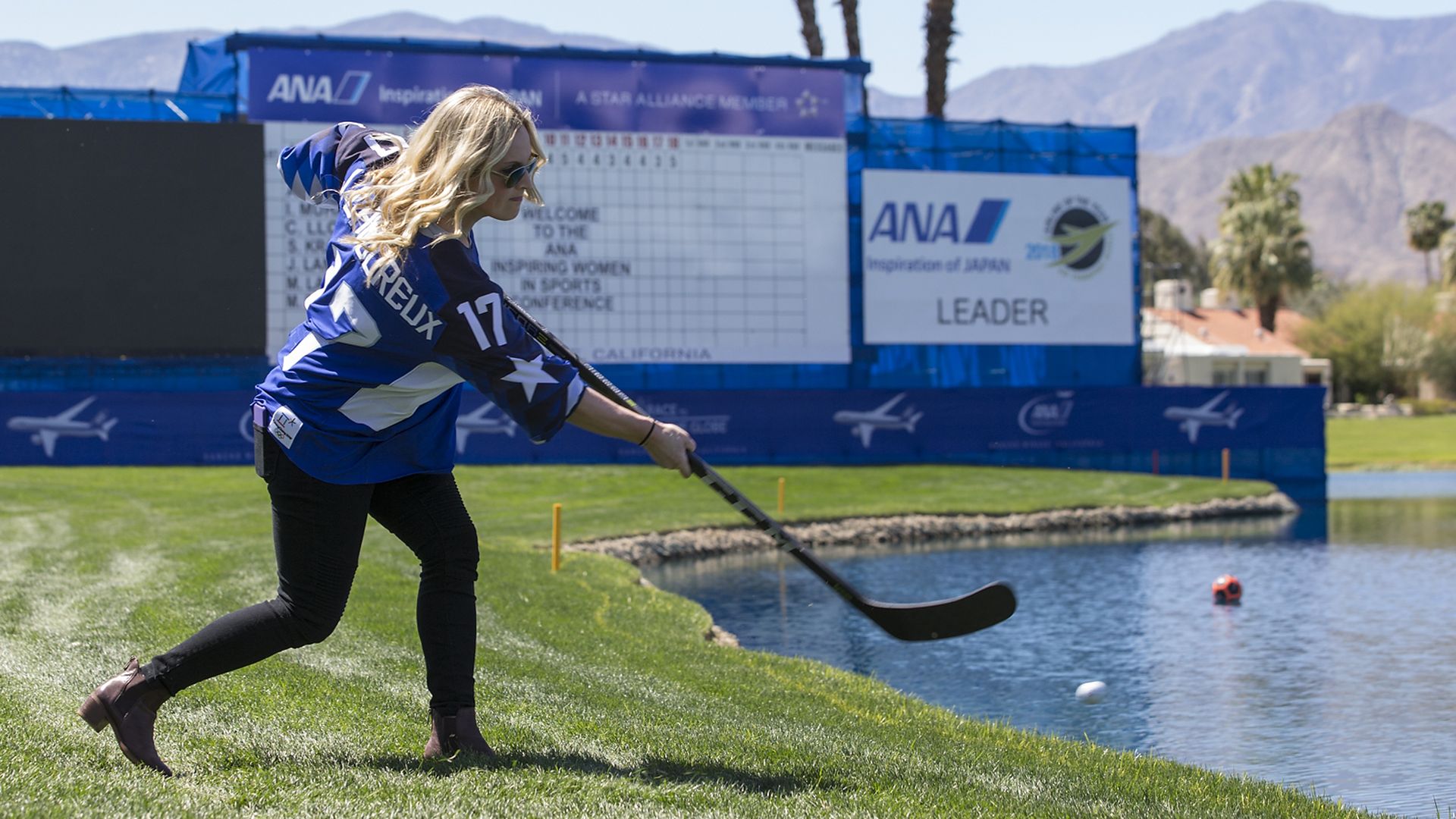 Jocelyne Lamoureux-Davidson shows her shot at a women in sports conference