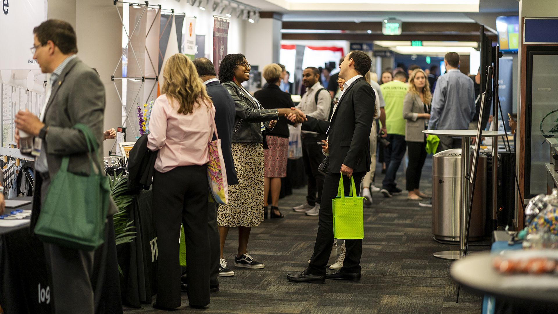 Conference attendees stand around