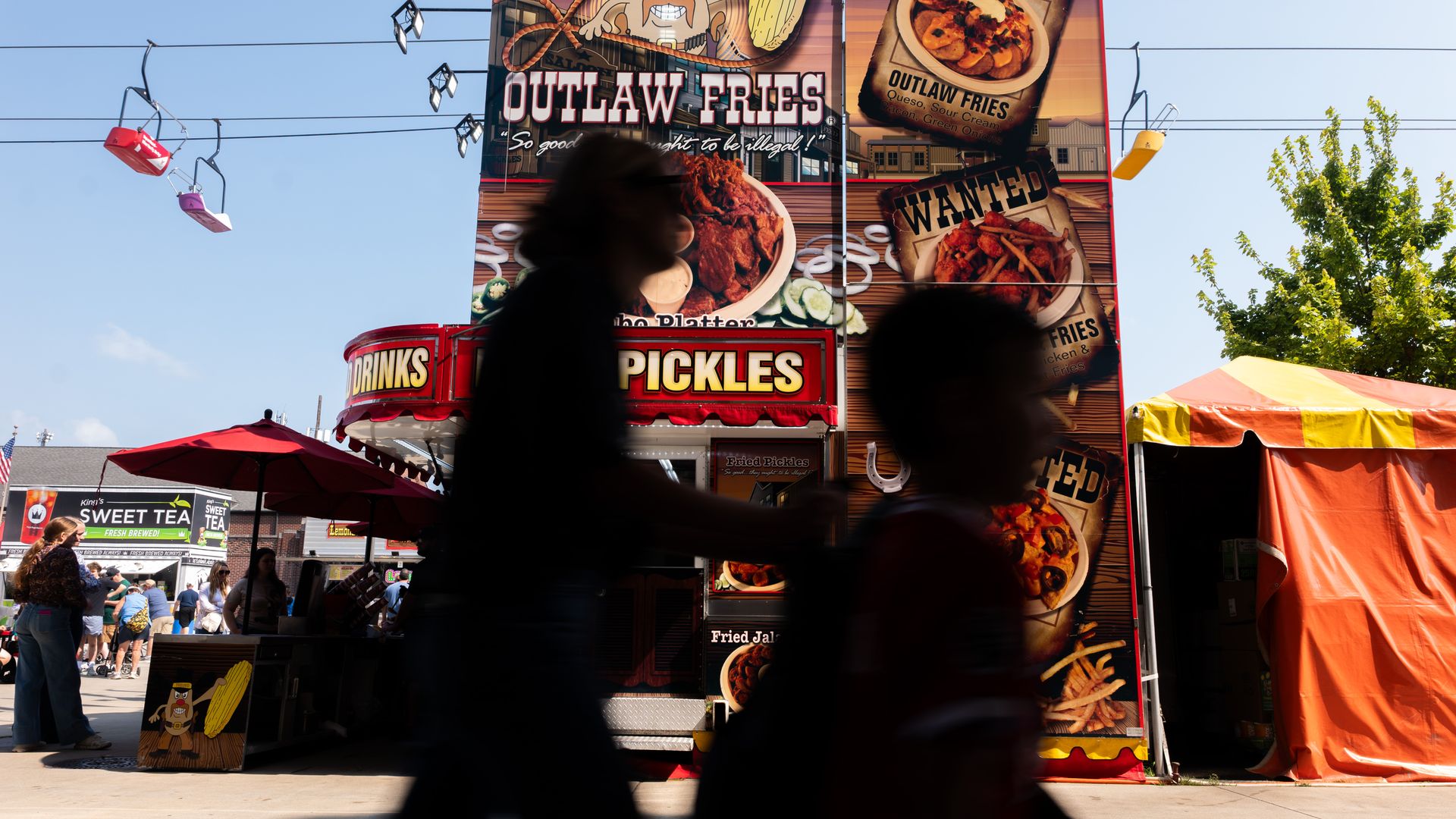People attend the Indiana State Fair on its opening day at the Indiana State Fairgrounds & Event Center in Indianapolis on August 01, 2025 in Indianapolis, Indiana. Now in its 168th year, the event attracts nearly 1 million people over its two-week span. Visitors come for its art and music exhibits.