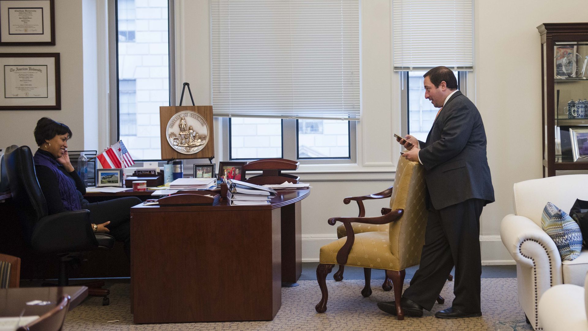 John Falcicchio stands across from Mayor Muriel Bowser inside her office